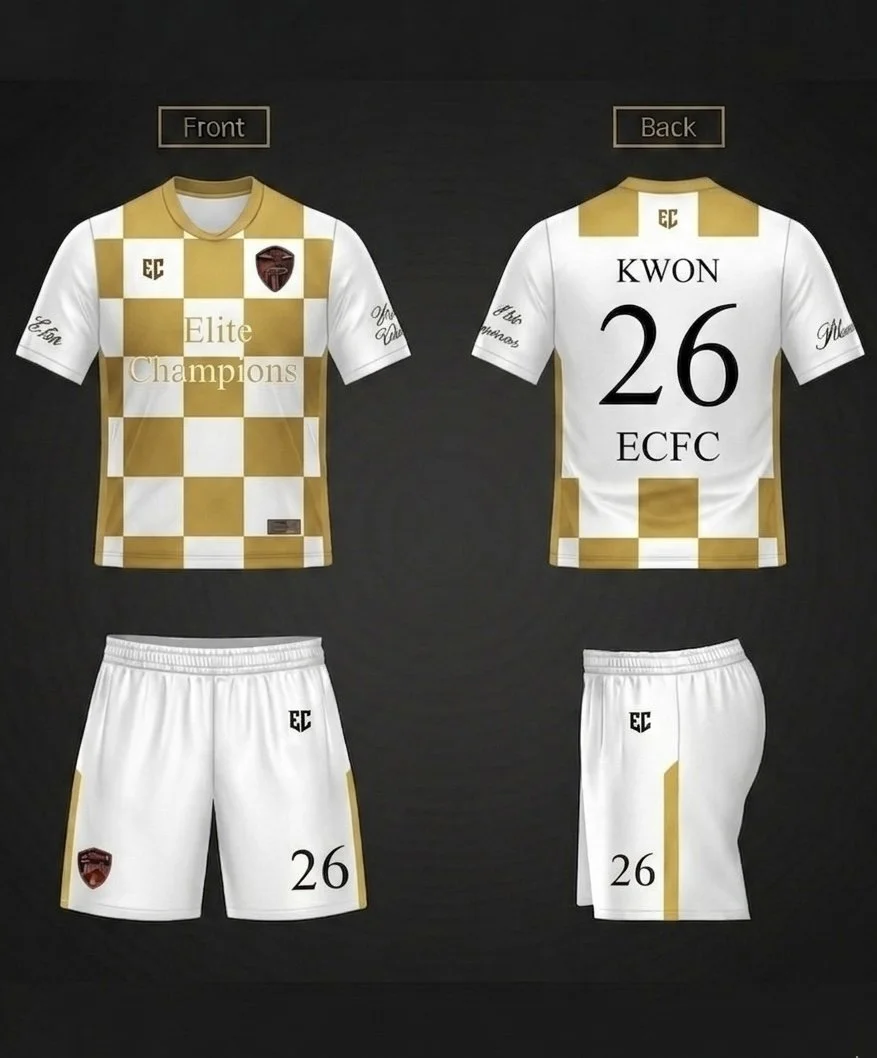 A white and gold checkered soccer jersey with the words 'Elite Champions' on the front, and a red and black shield logo. The back features the name 'KWON' with the number 26 and the letters 'ECFC'. The shorts are white with gold accents, the number 26, and the same shield logo.