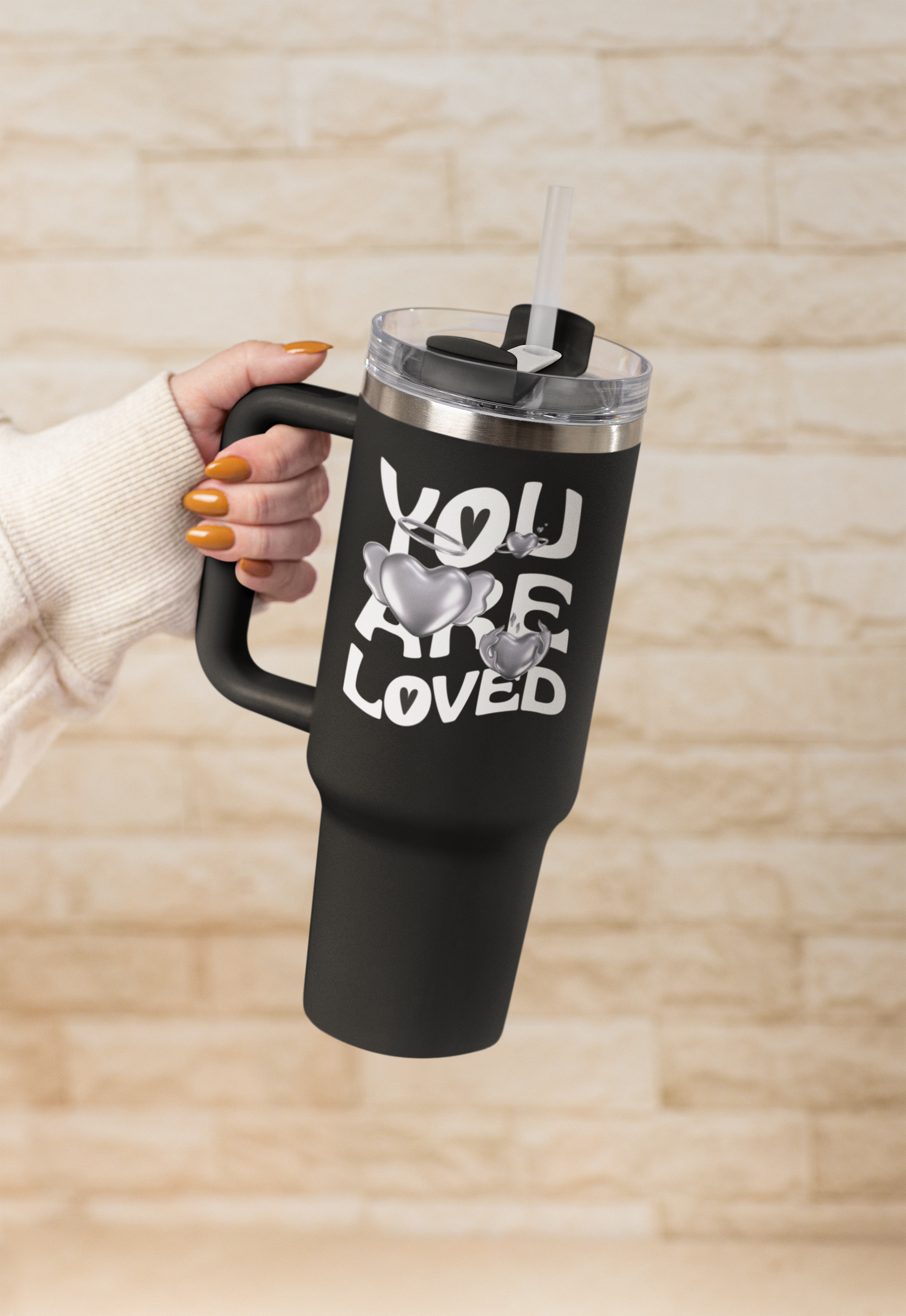 stanley-mockup-featuring-a-woman-s-hand-holding-a-tumbler-m54043.png