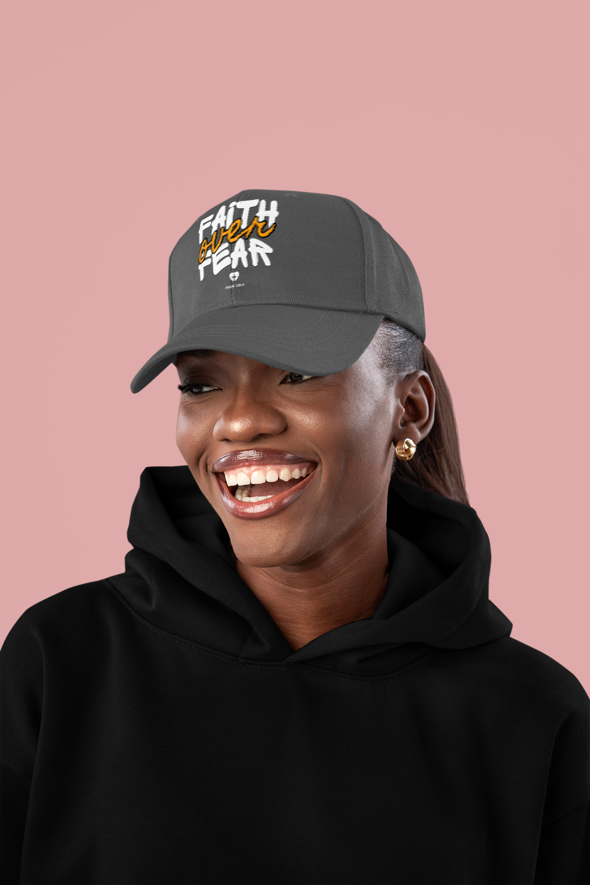 dad-hat-mockup-of-a-smiling-woman-wearing-a-pullover-hoodie-in-a-studio-m56566.png