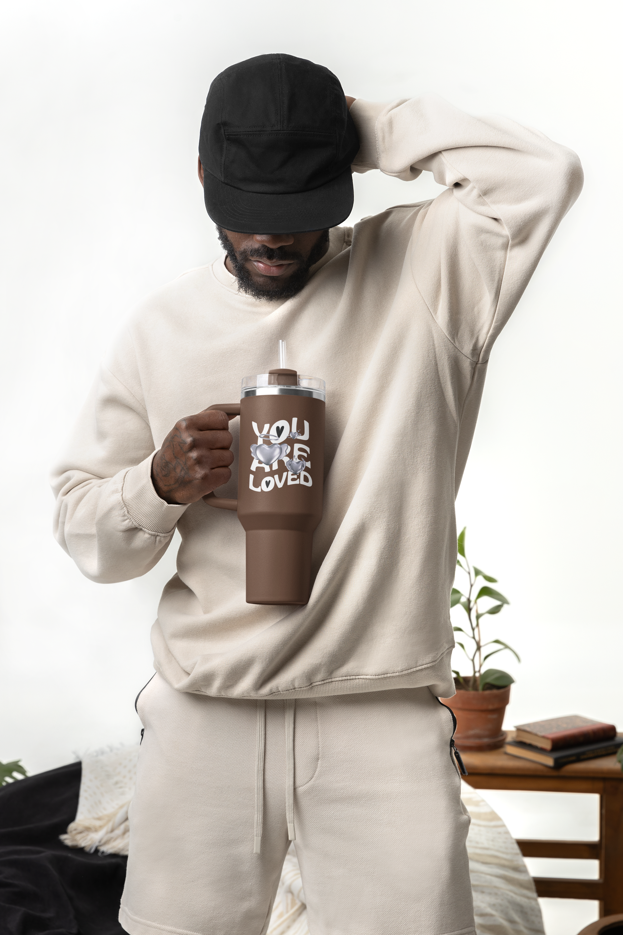 mockup-of-a-bearded-man-holding-a-sublimated-stanley-tumbler-m40298.png