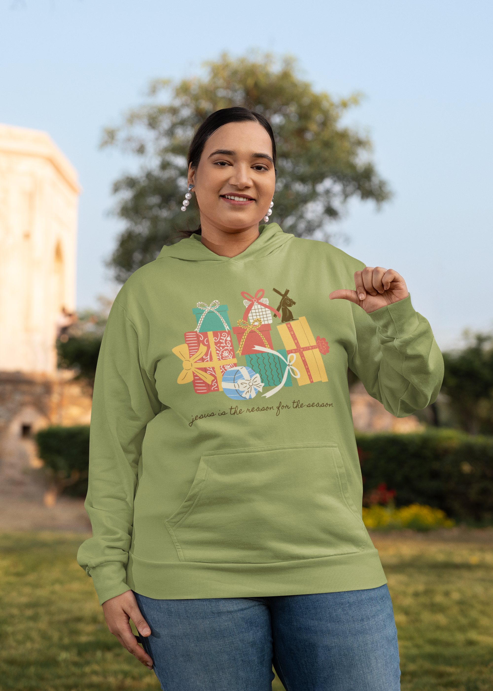 mockup-of-a-woman-happily-pointing-at-her-plus-size-gildan-hoodie-m39617.png