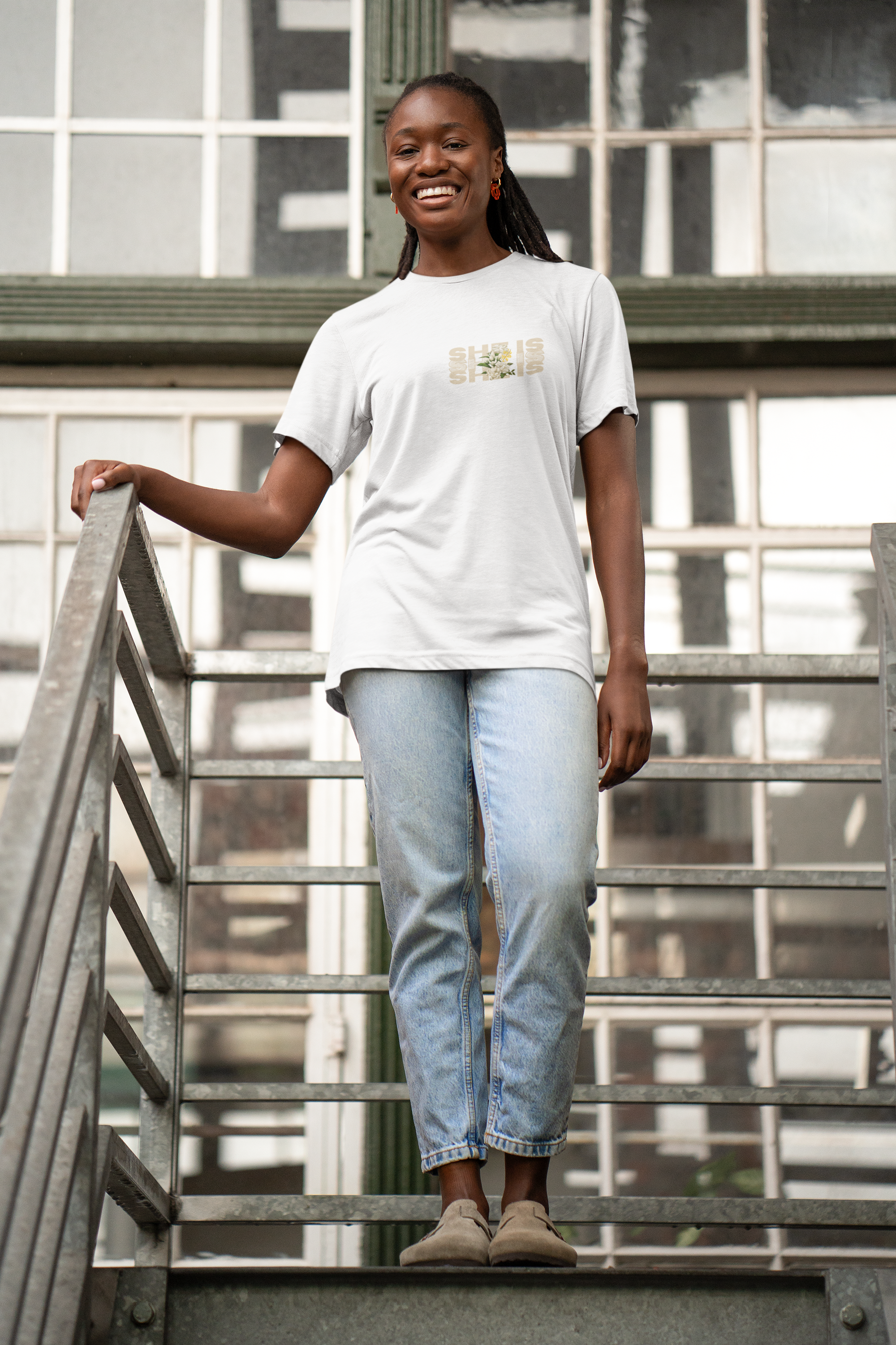 bella-canvas-tee-mockup-featuring-a-joyful-woman-in-a-staircase-m39784.png