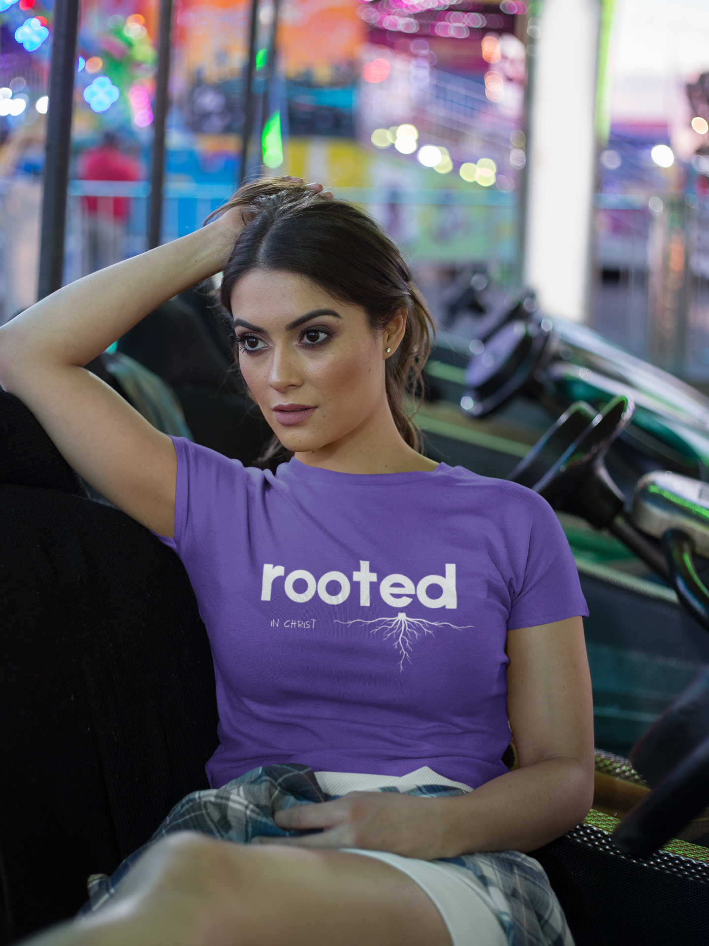 crop-top-tee-mockup-being-worn-by-a-girl-lying-on-the-arcade-car-games-a19440.png