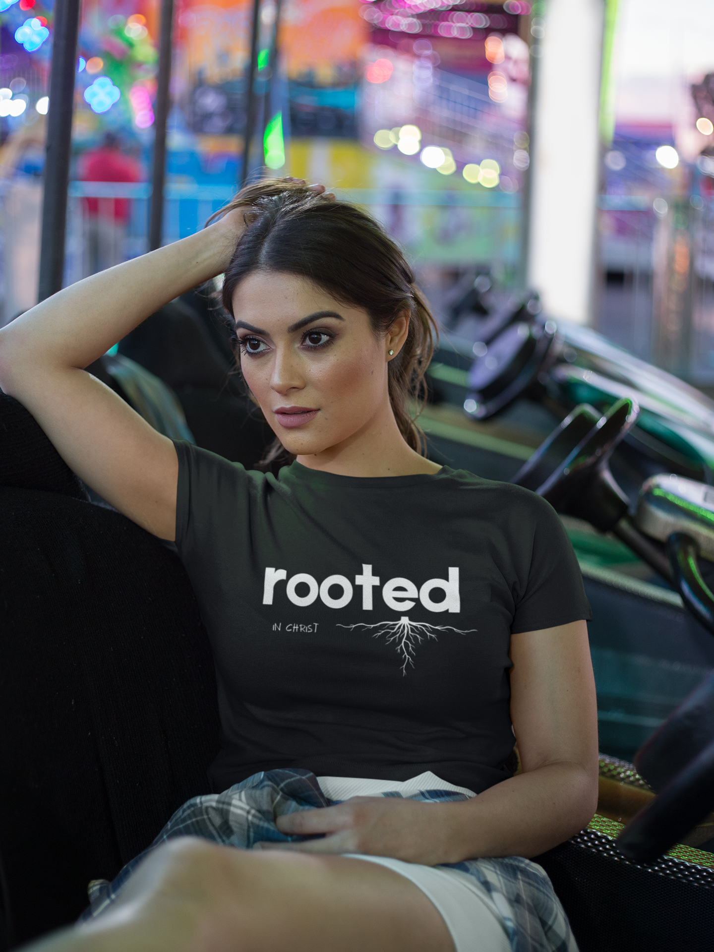 crop-top-tee-mockup-being-worn-by-a-girl-lying-on-the-arcade-car-games-a19440 (1).png