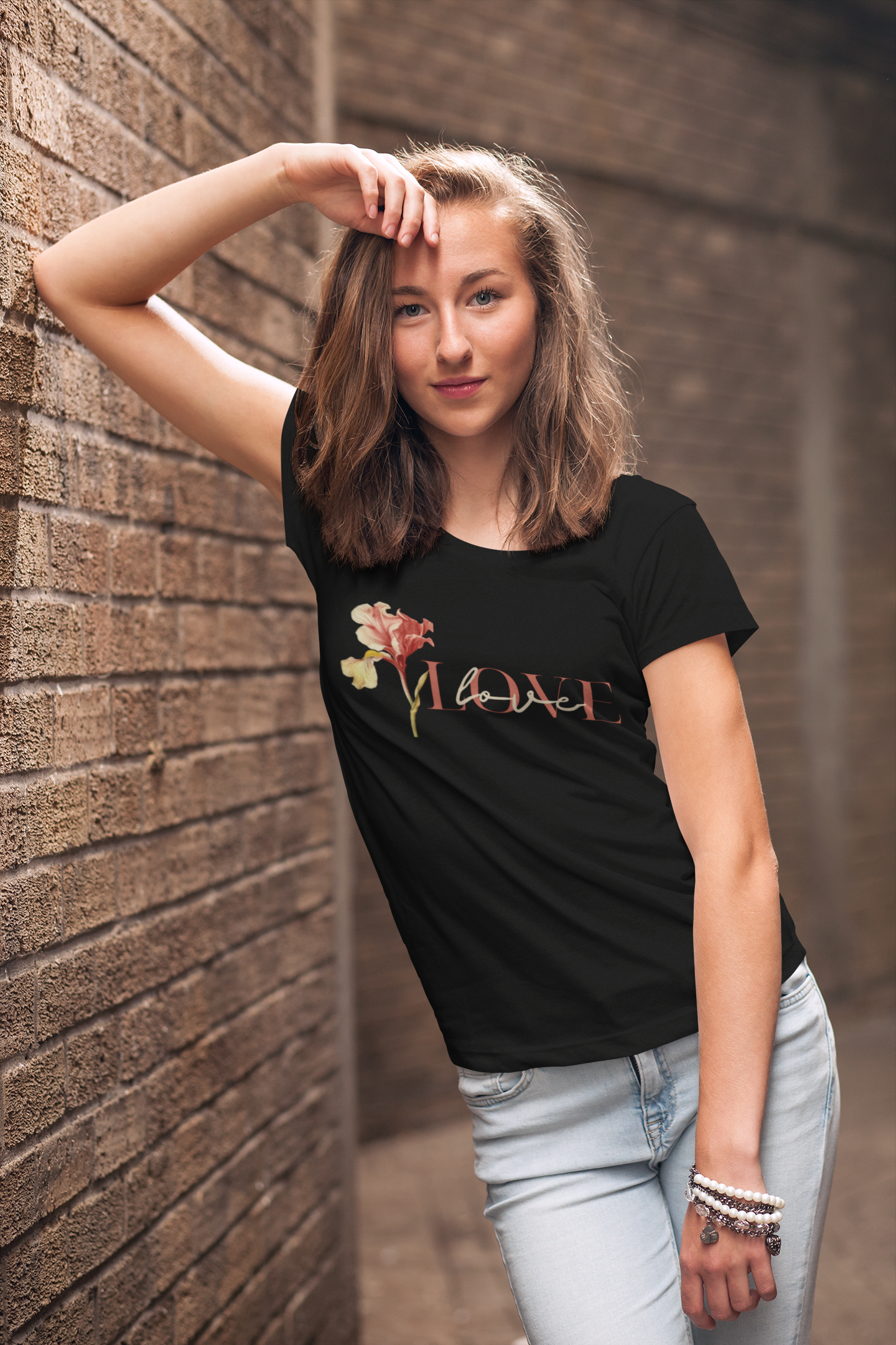 mockup-of-a-young-woman-wearing-a-customizable-t-shirt-and-leaning-against-a-brick-wall-2764-el1 (1).png
