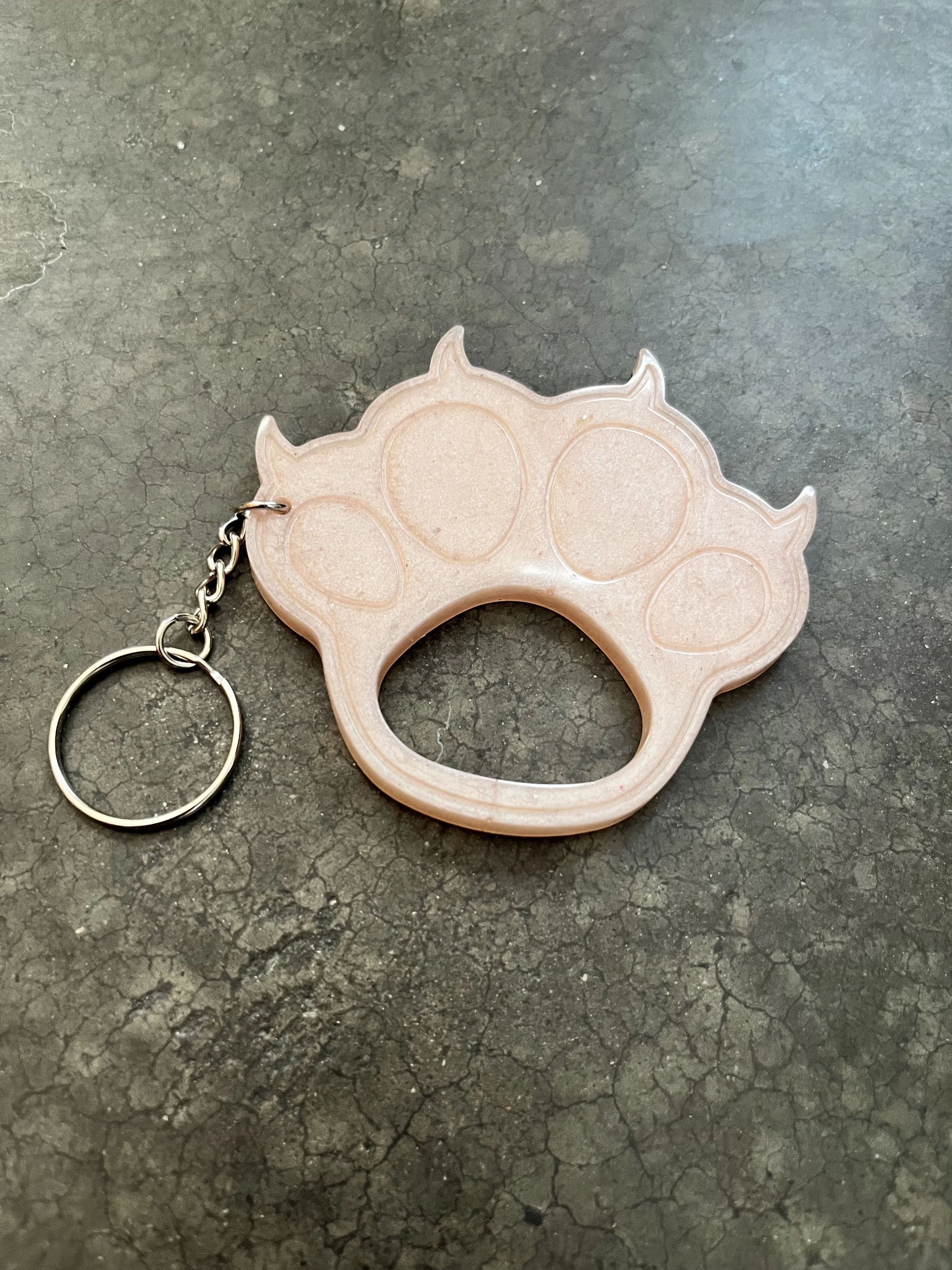 A pink paw resin epoxy emergency keychain.
