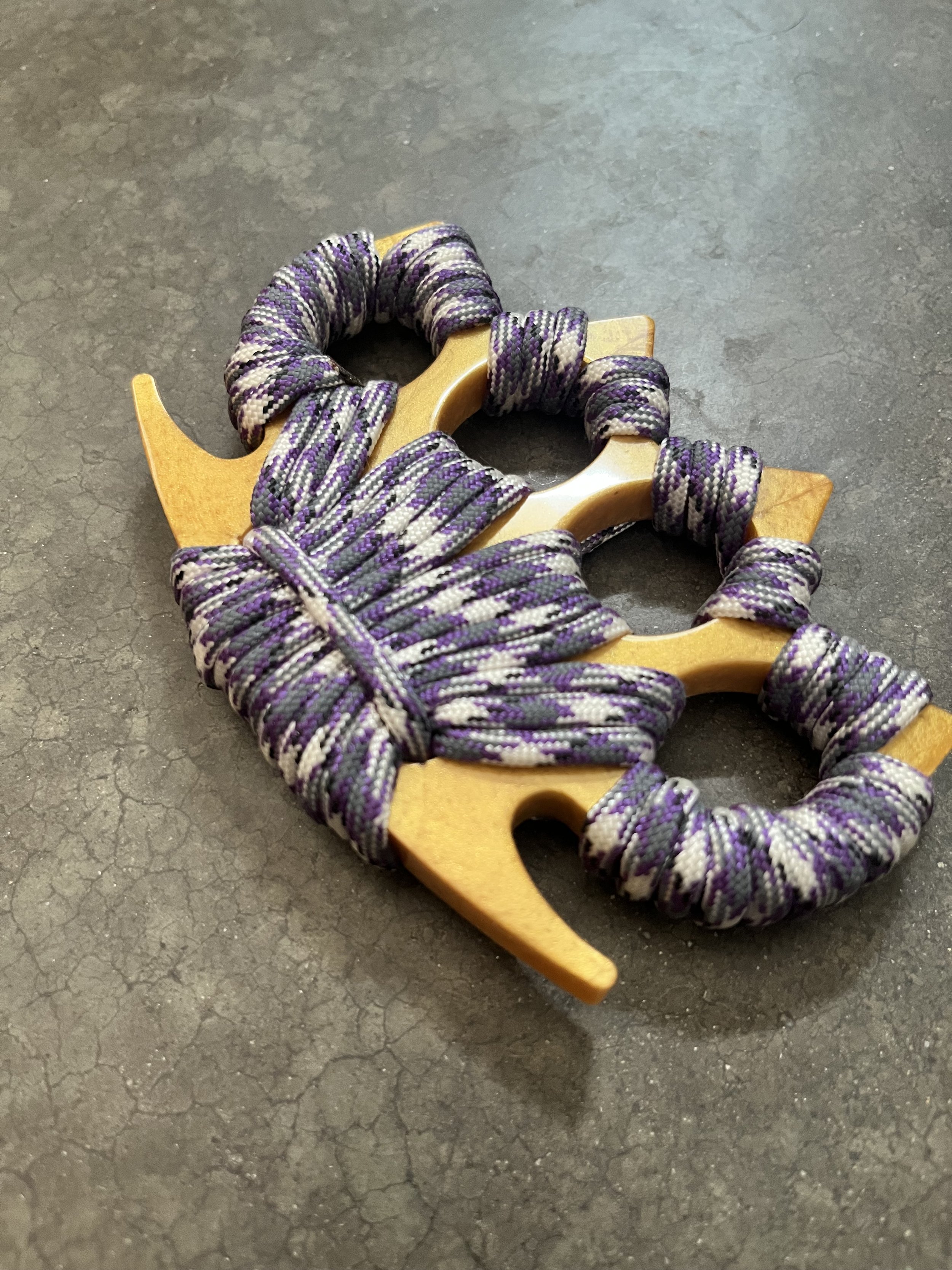 A handmade paracord and resin epoxy emergency knuckle accessory.
