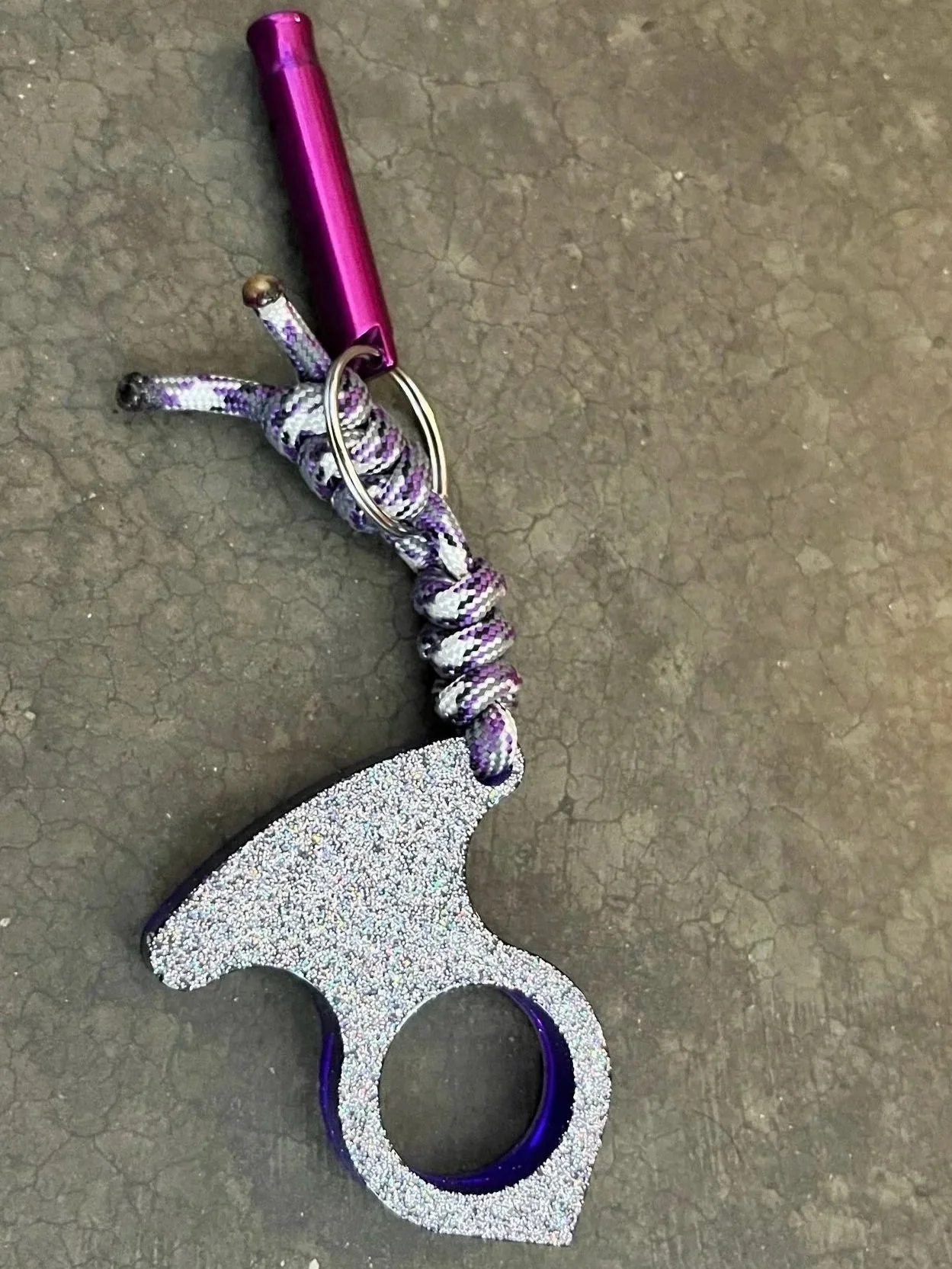 A glittery purple keychain.