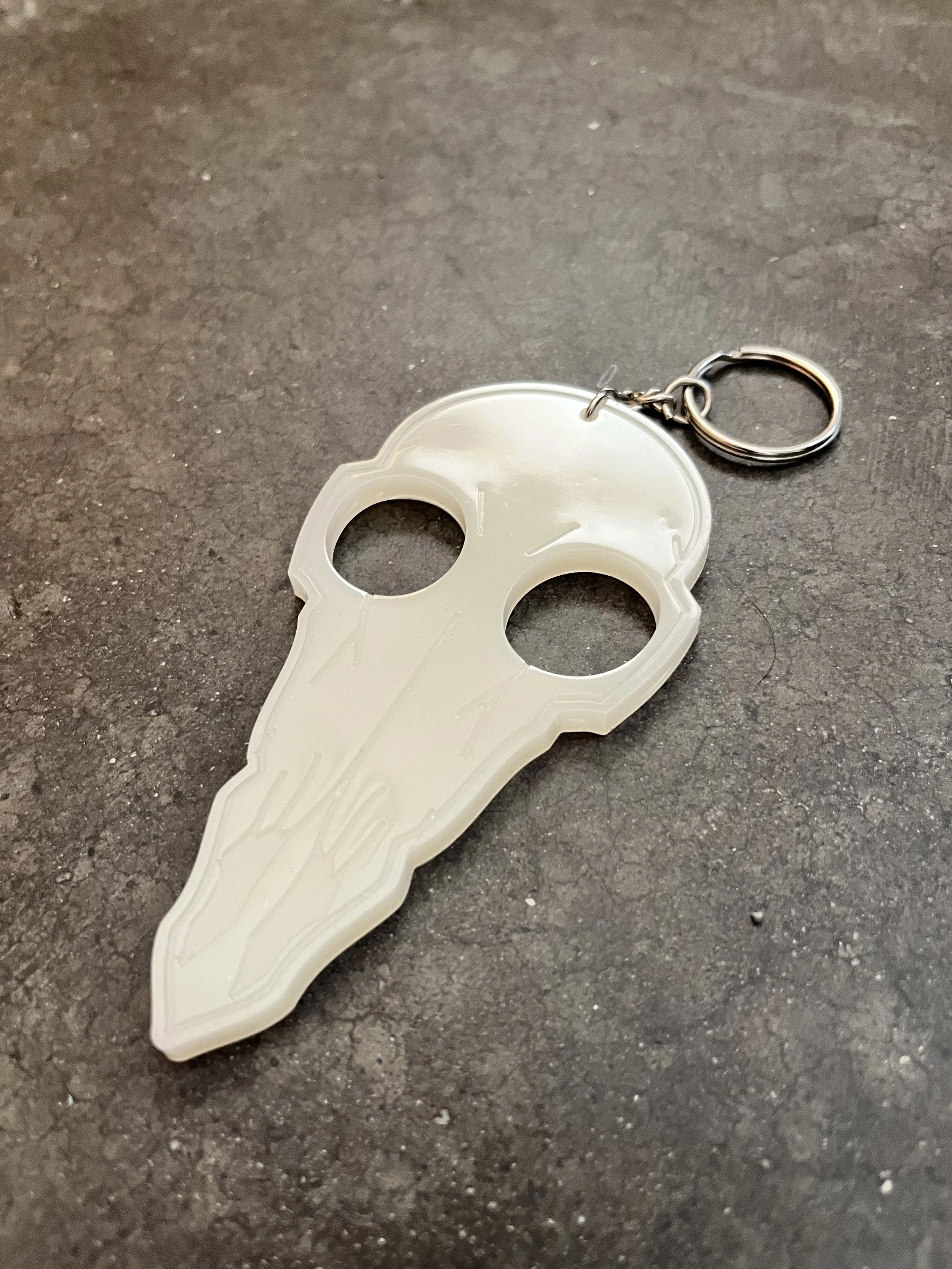 A bird skull emergency keychain made from epoxy resin.