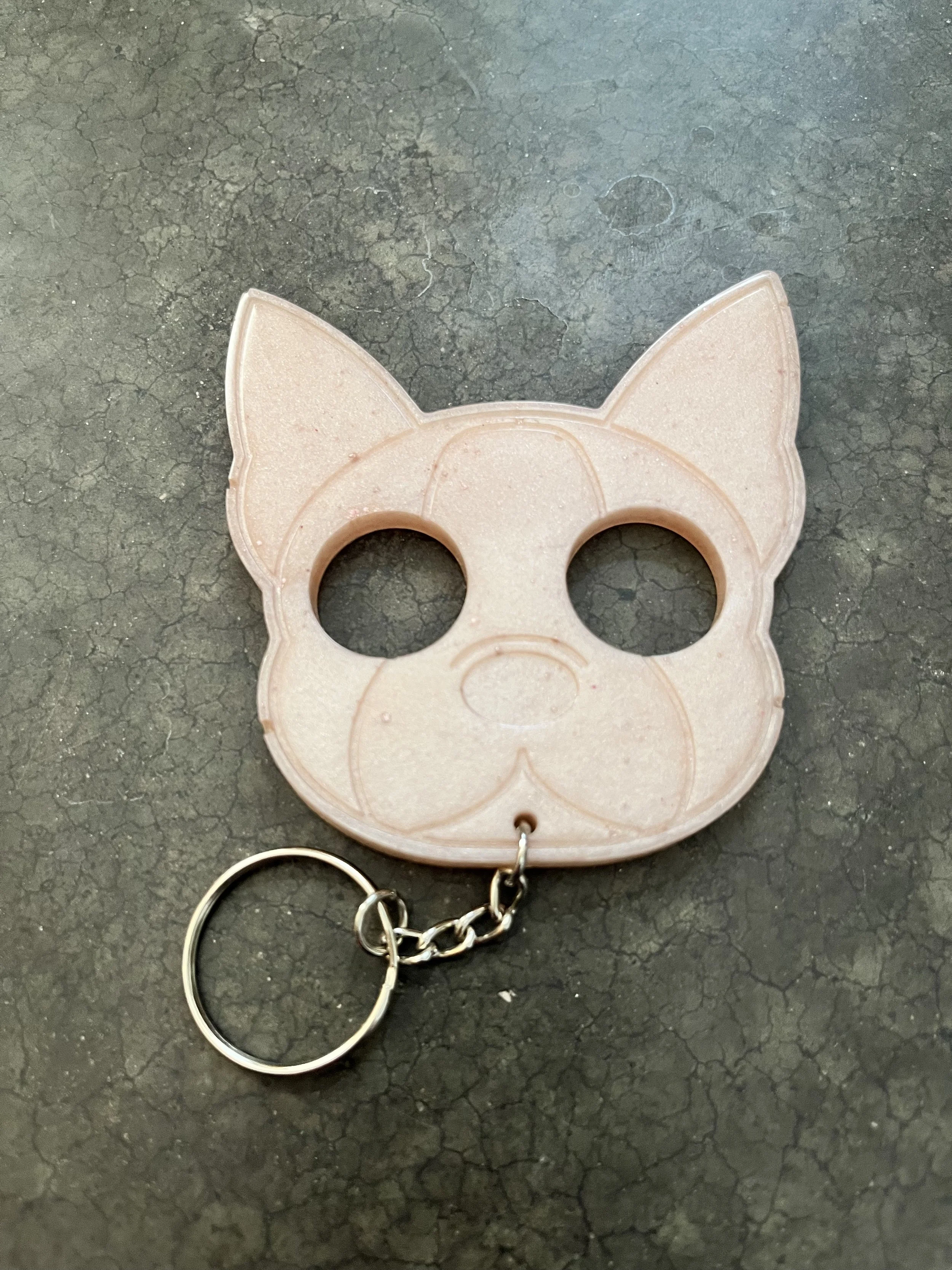 A handmade dog resin epoxy emergency keychain.