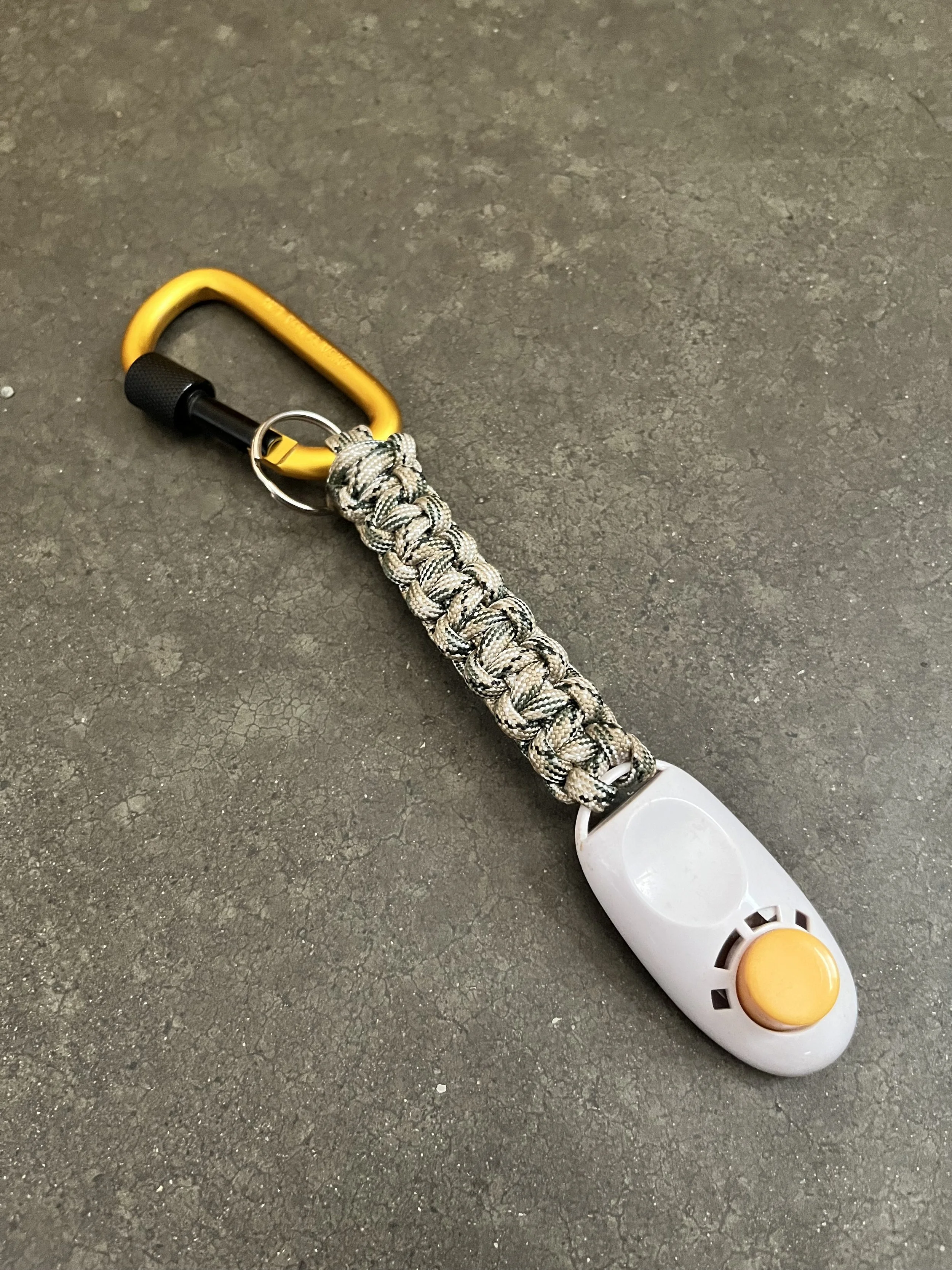 A handmade paracord lanyard with a carabiner.