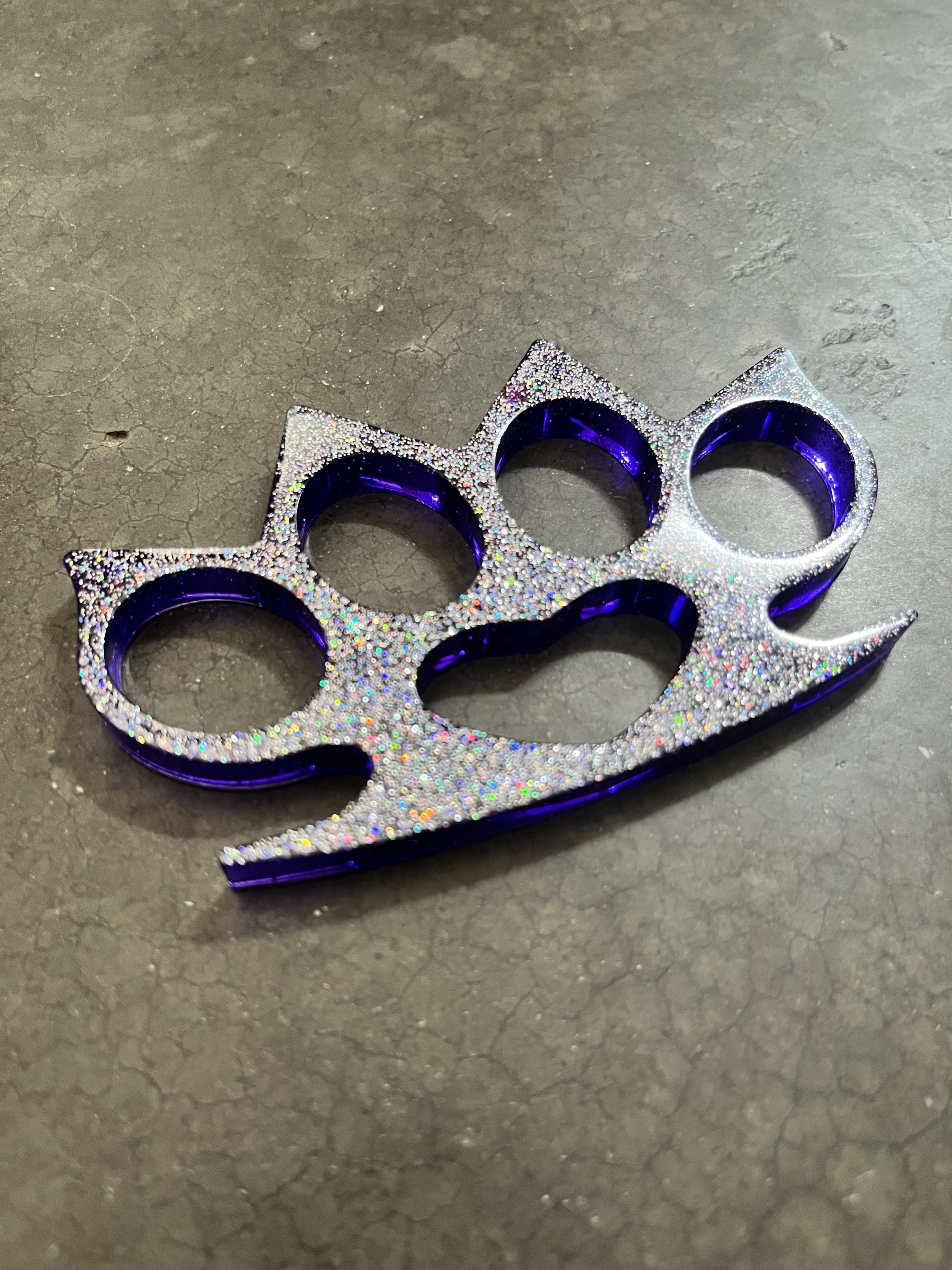 A handmade resin epoxy emergency knuckle accessory.Totally legal.