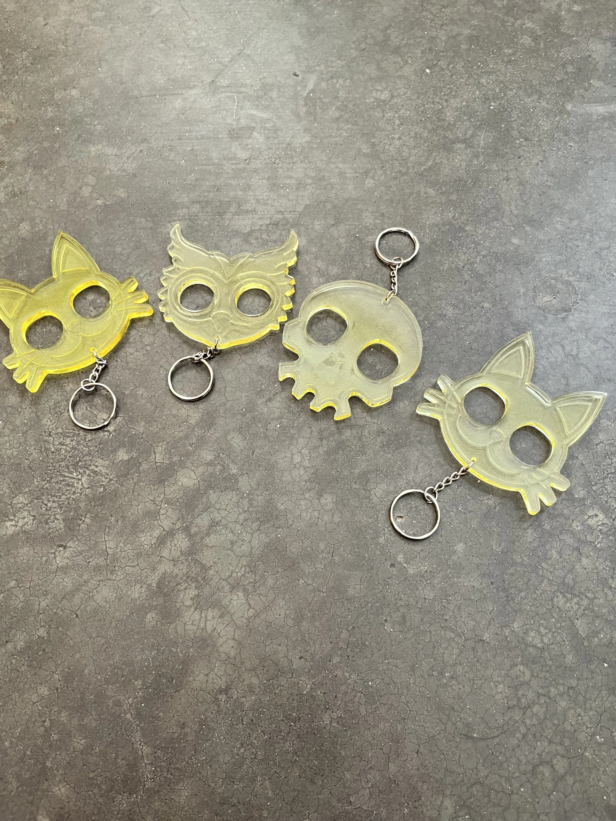 Yellow emergency keychains made from epoxy resin.