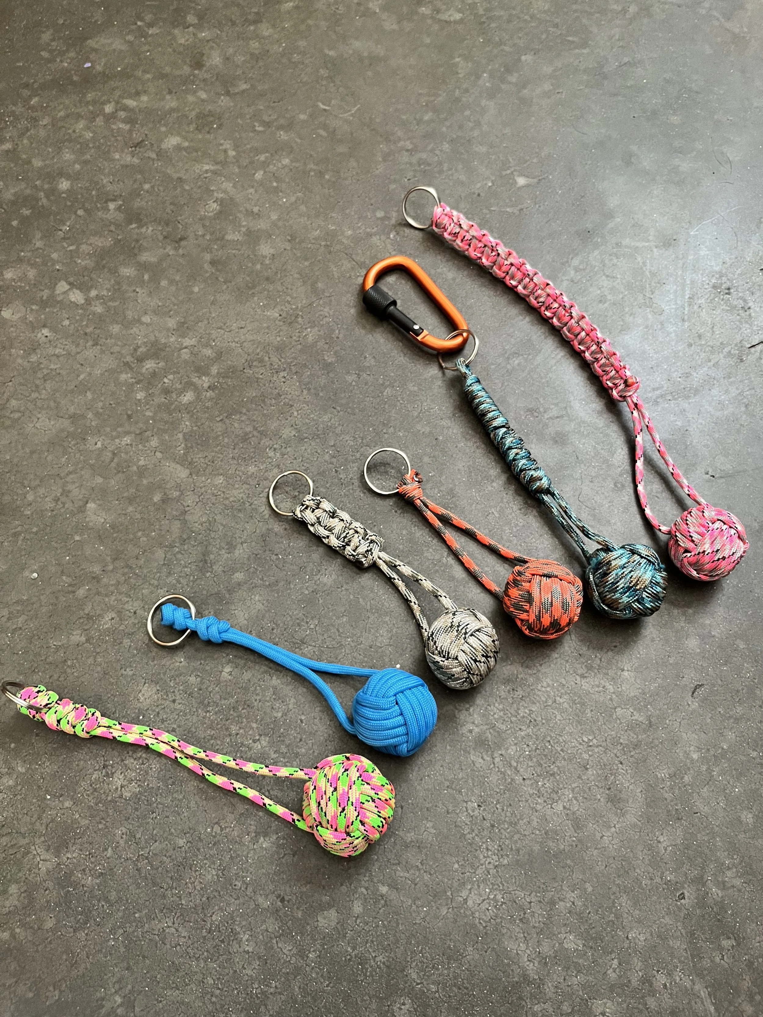 Multiple handmade colorful emergency ball keychains.Monkey balls.