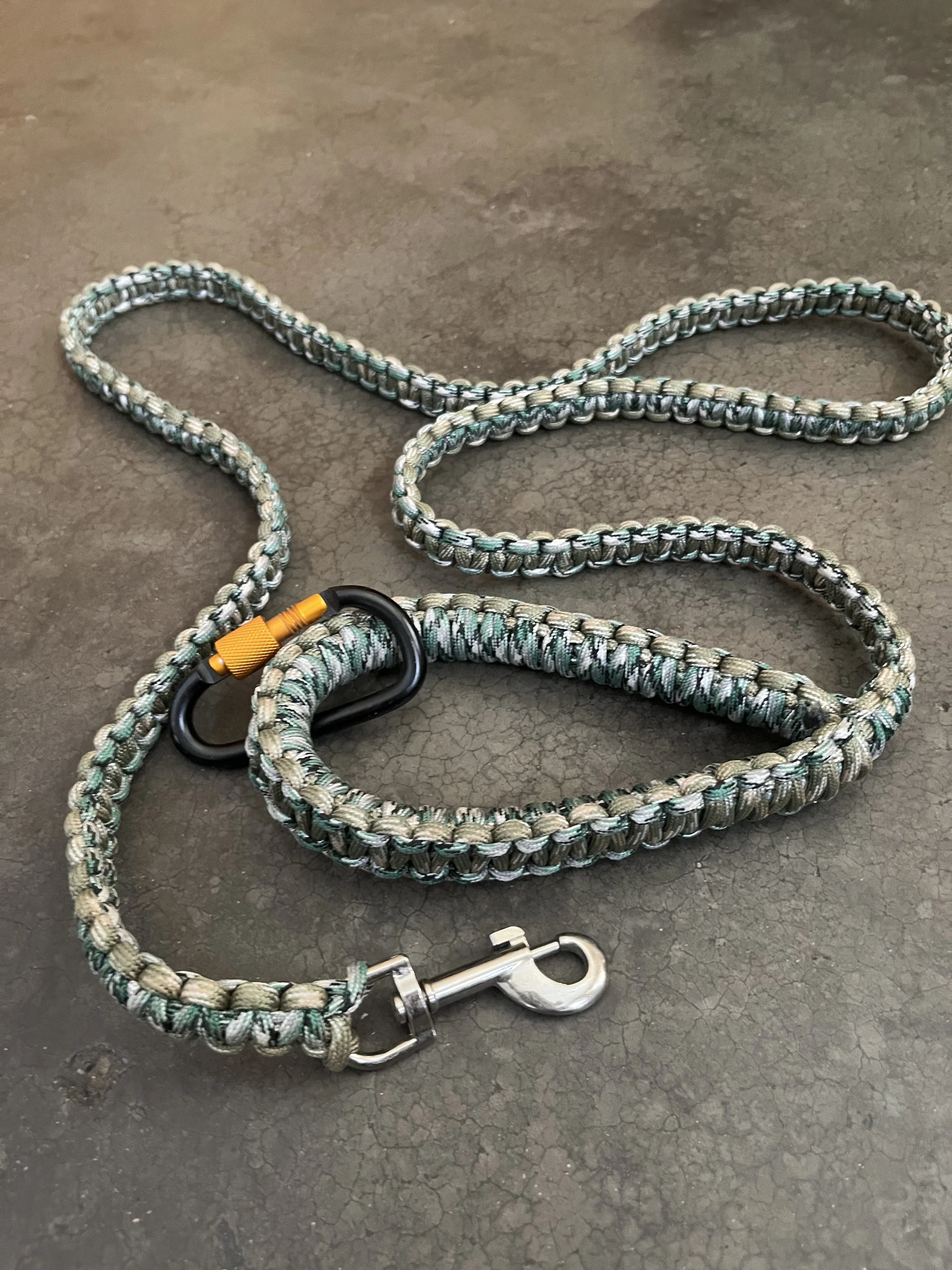 A handmade paracord dog leash with a carabiner.