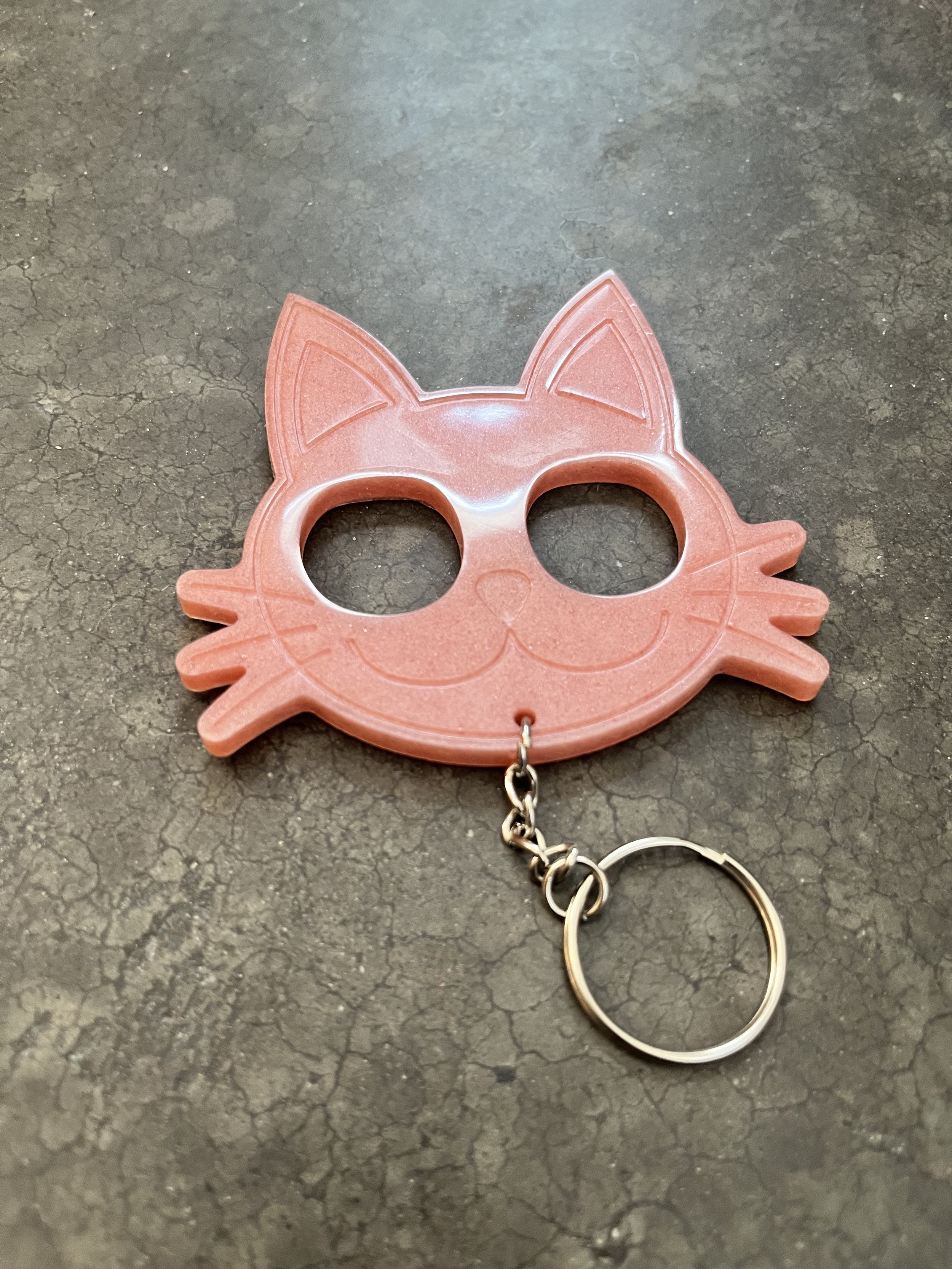 Cat face emergency keychain made from epoxy resin.
