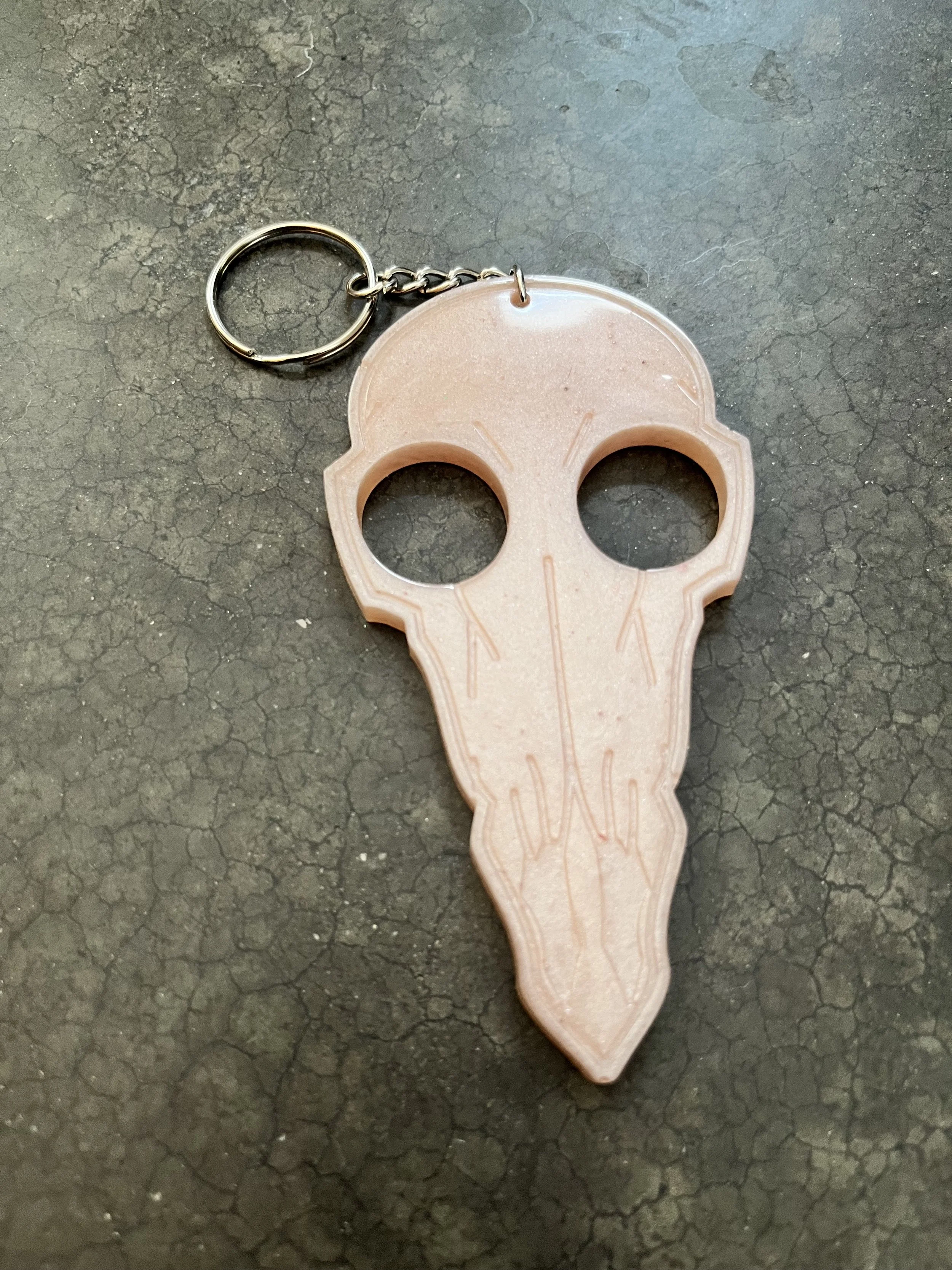 A bird skull keychain for emergencies.