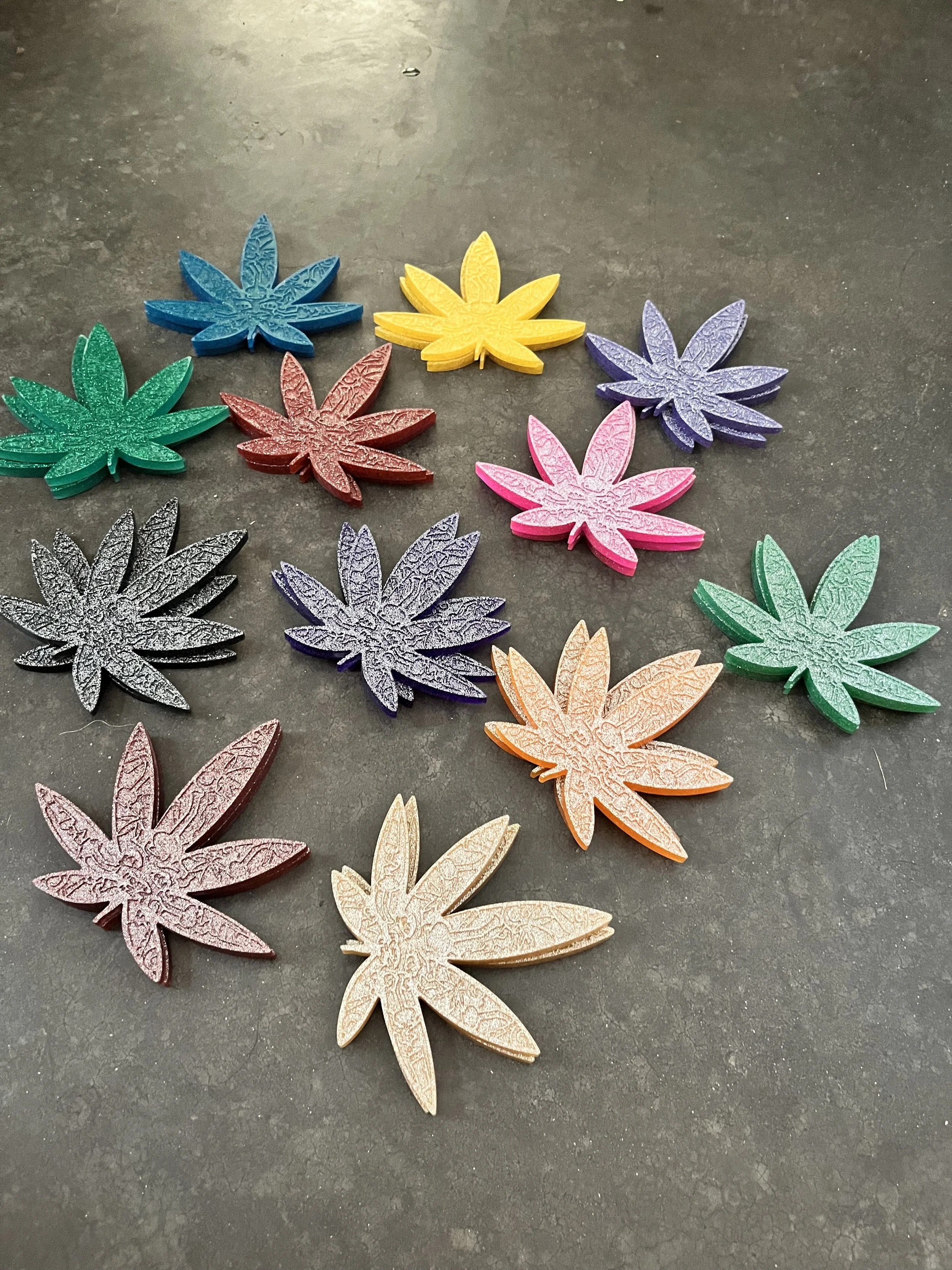 Colorful handmade marijuana coasters.