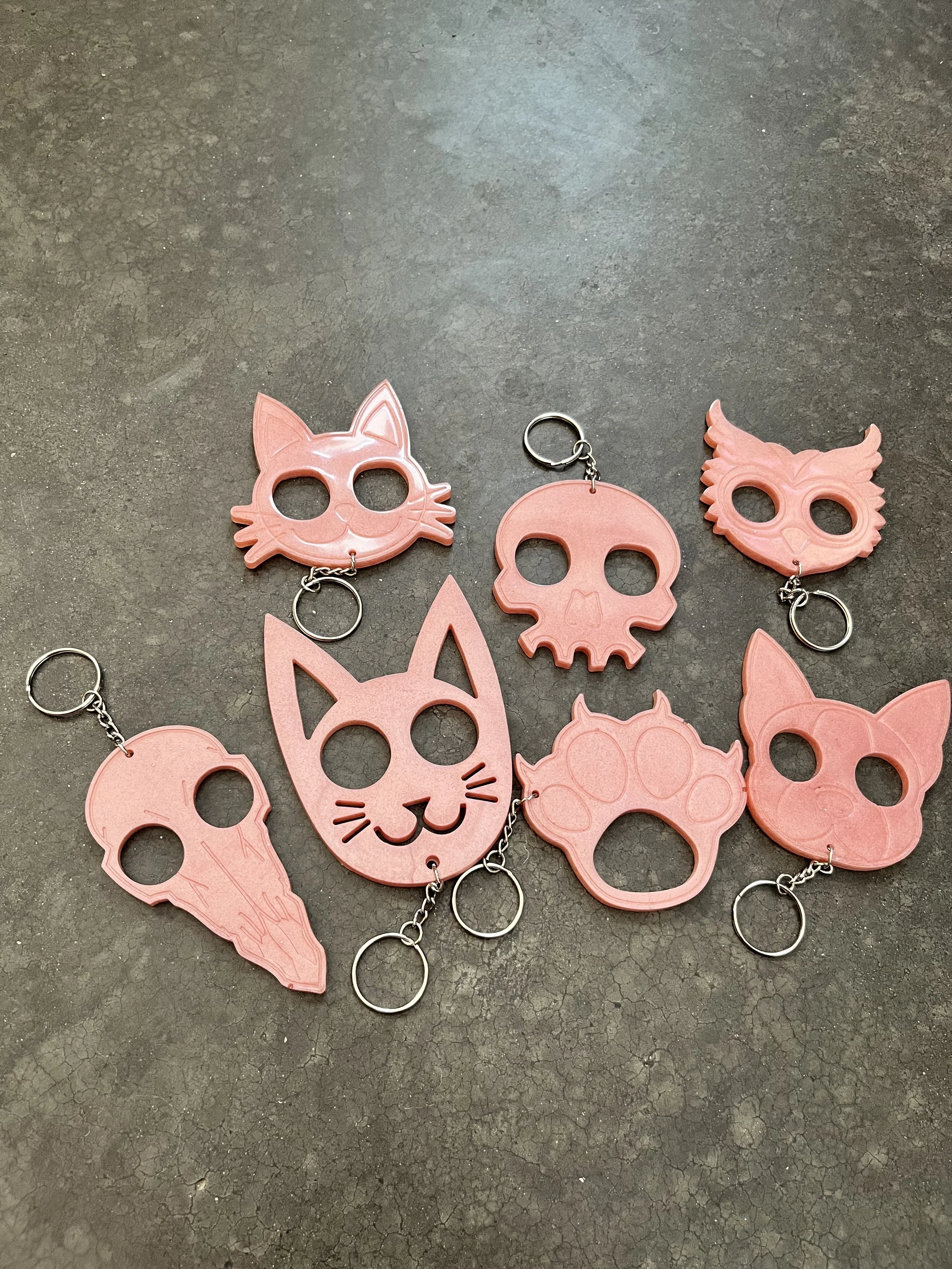 Orange epoxy resin emergency keychains.