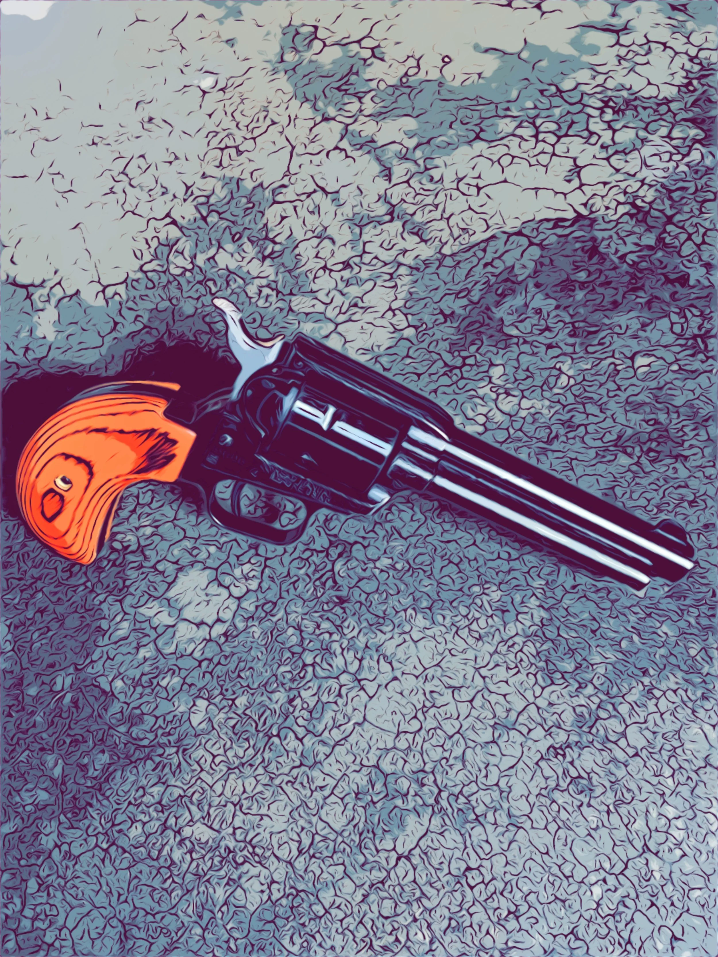 A revolver with an orange grip, pointing downward, resting on cracked, dry earth.