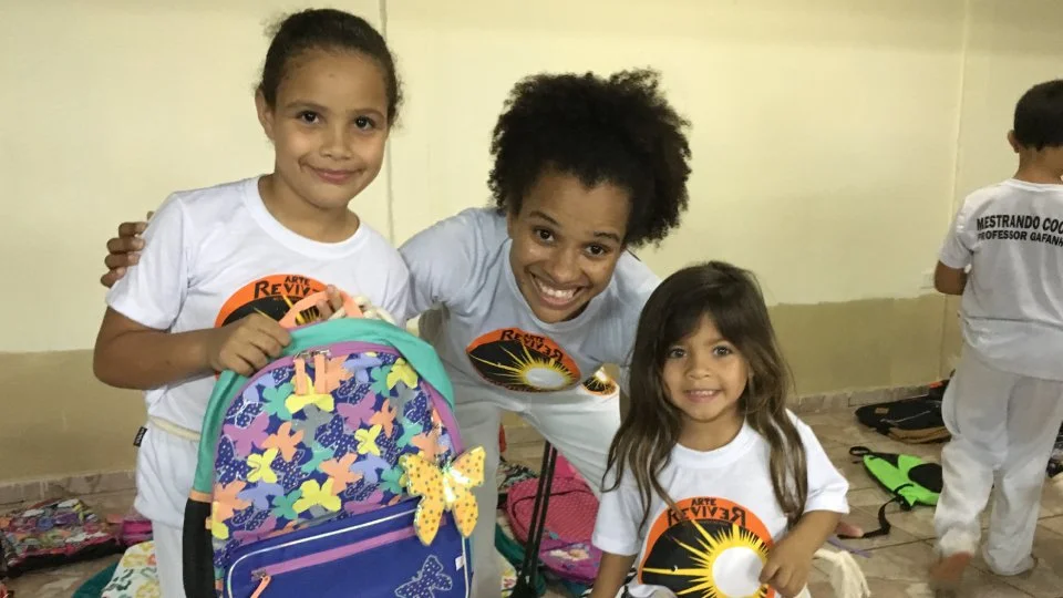 Students participating in Capoeira outreach programs