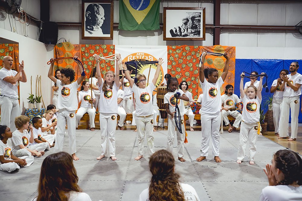 Capoeira New Orleans students celebrating progress and achievement