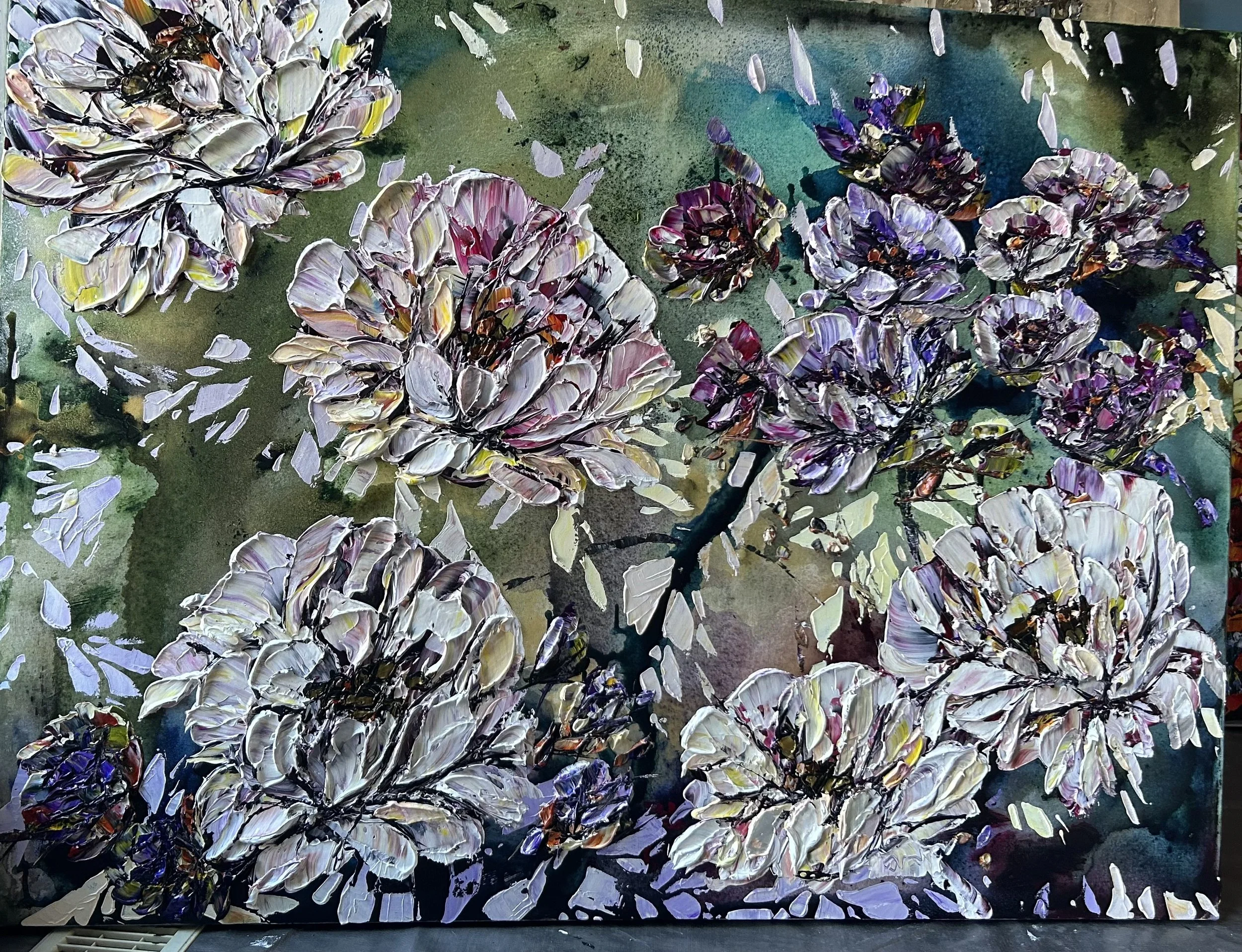 An abstract painting of flowers with thick, textured brushstrokes, featuring shades of white, purple, and pink, set against a green and blue background.
