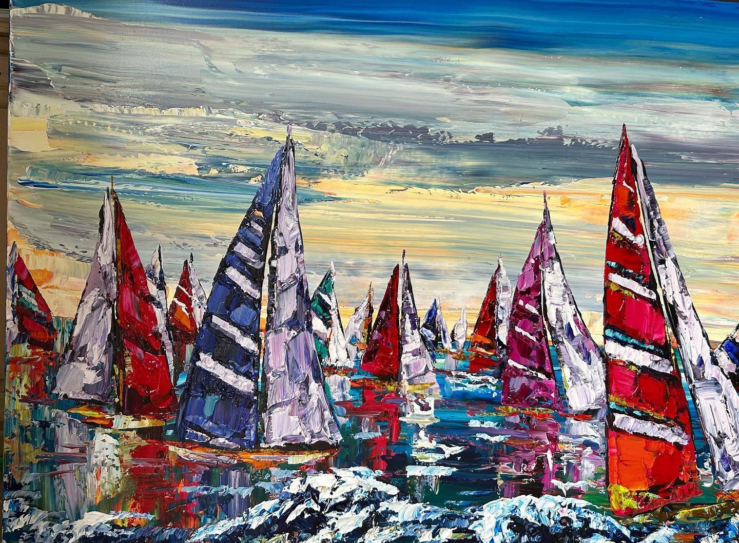 A dynamic palette knife impasto painting by Canadian artist Maya Eventov, capturing a fleet of sailboats with vividly colored sails against a dramatic sky. Thick, textured brushwork brings movement and energy to the scene, showcasing Eventov's sculpt