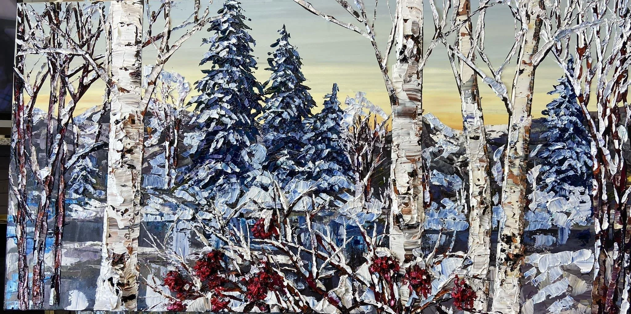 A painting of a winter landscape with snow-covered trees, pine trees in the background, and a colorful sky at sunset.