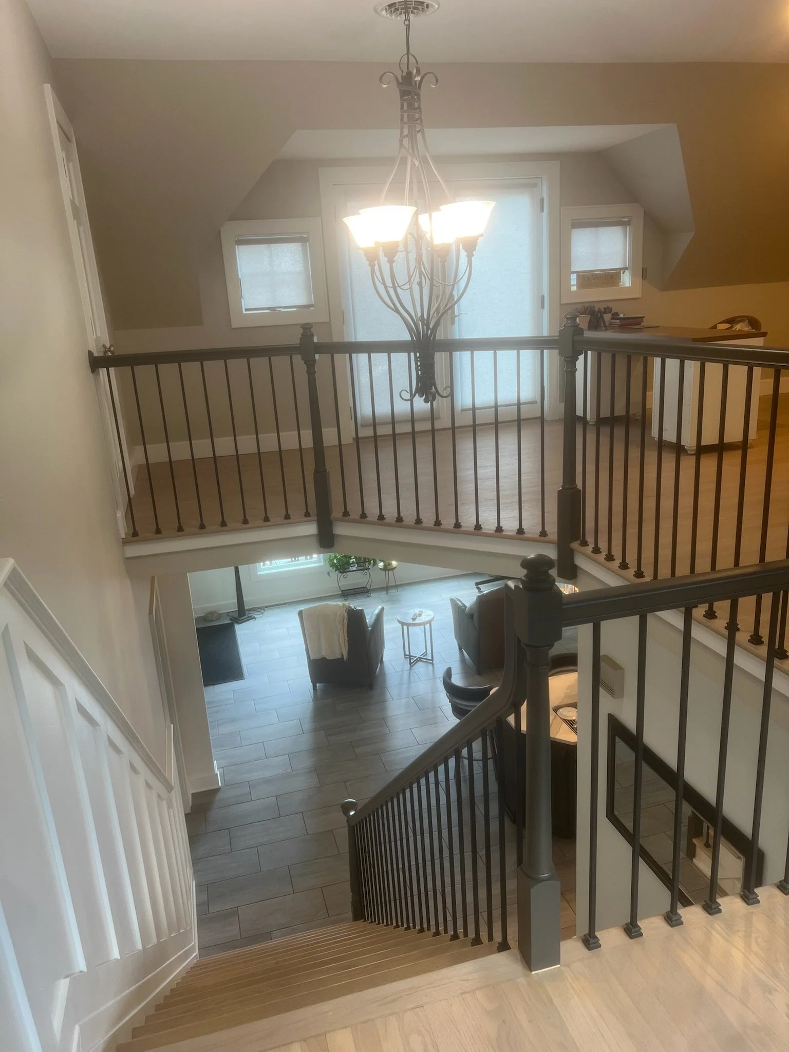 view of entire downstairs from upstairs in middle of home after a fresh remodel