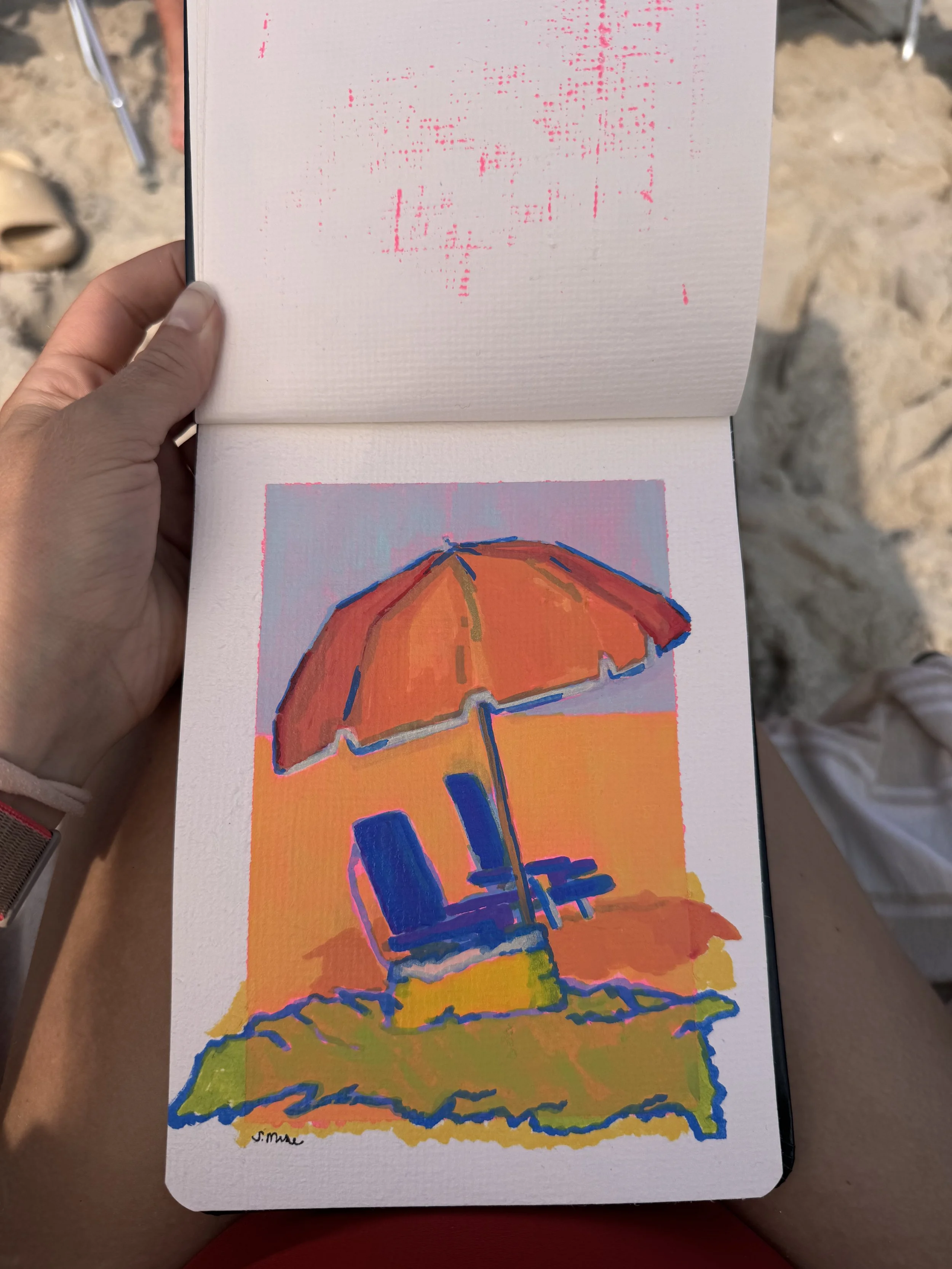 A colorful illustration of a beach umbrella with chairs underneath, set against a vibrant, sunset sky with warm tones of orange, pink, and purple, and a green patch of land in the foreground.