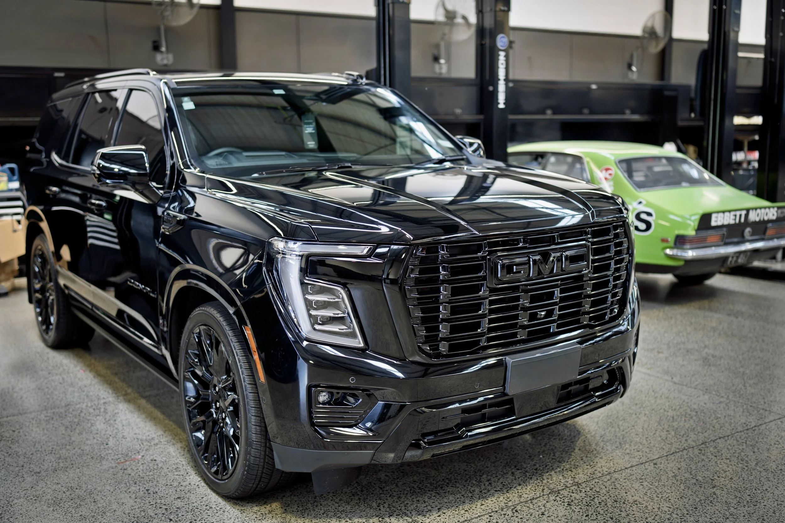 Black GMC protected with a premium Body-Liner coating system