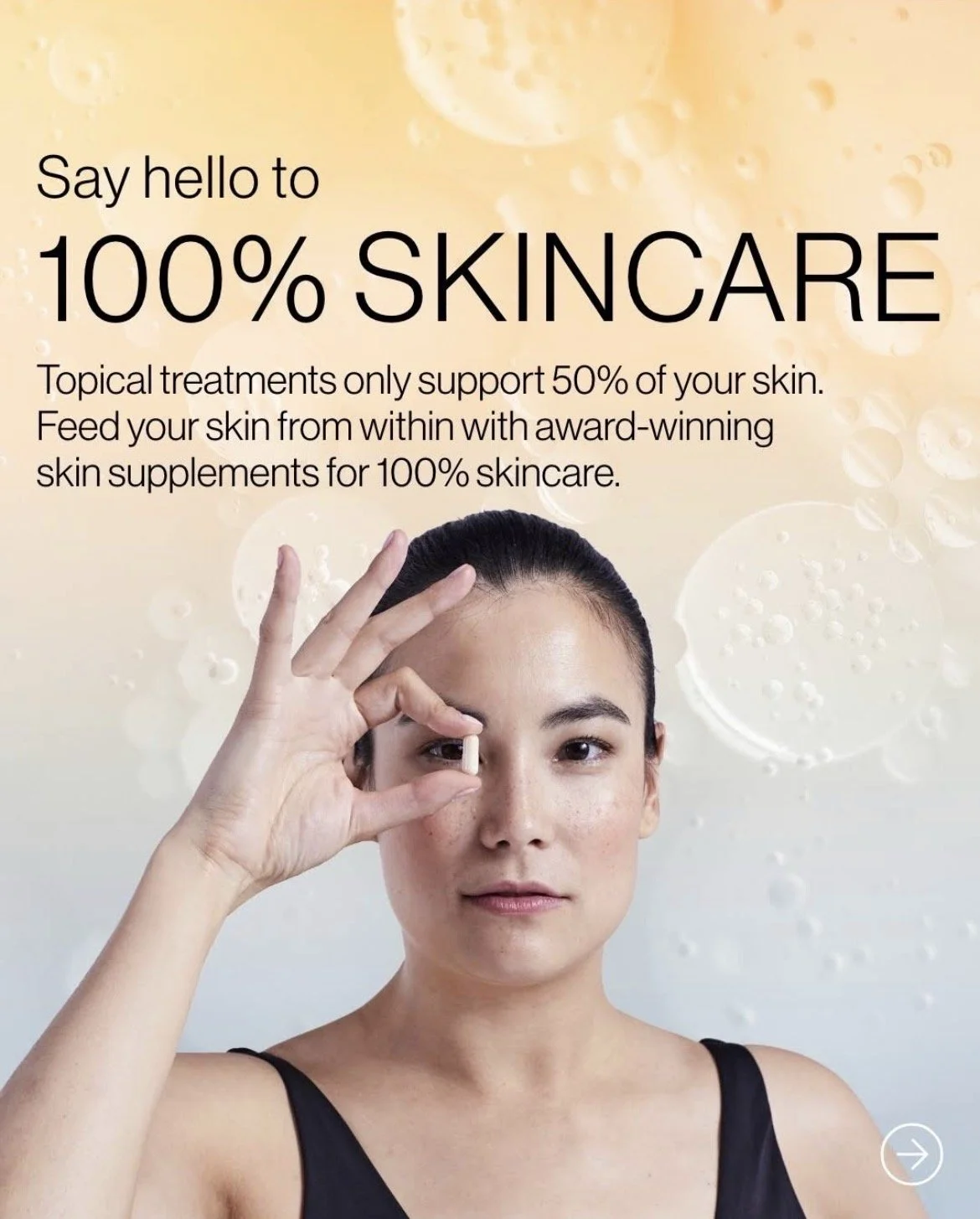 A woman with dark hair pulled back holding a small skincare pill between her thumb and forefinger near her eye. The background features light-colored skincare-themed visuals with text promoting skincare and topical treatments.