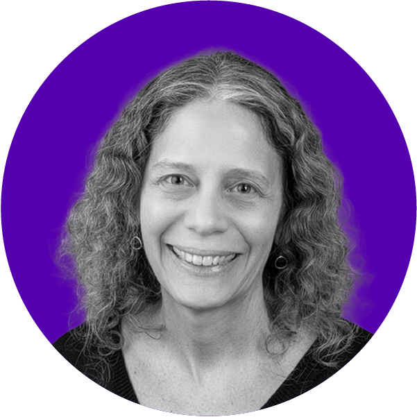 Black and white headshot of a woman with curly hair smiling, set against a purple background.