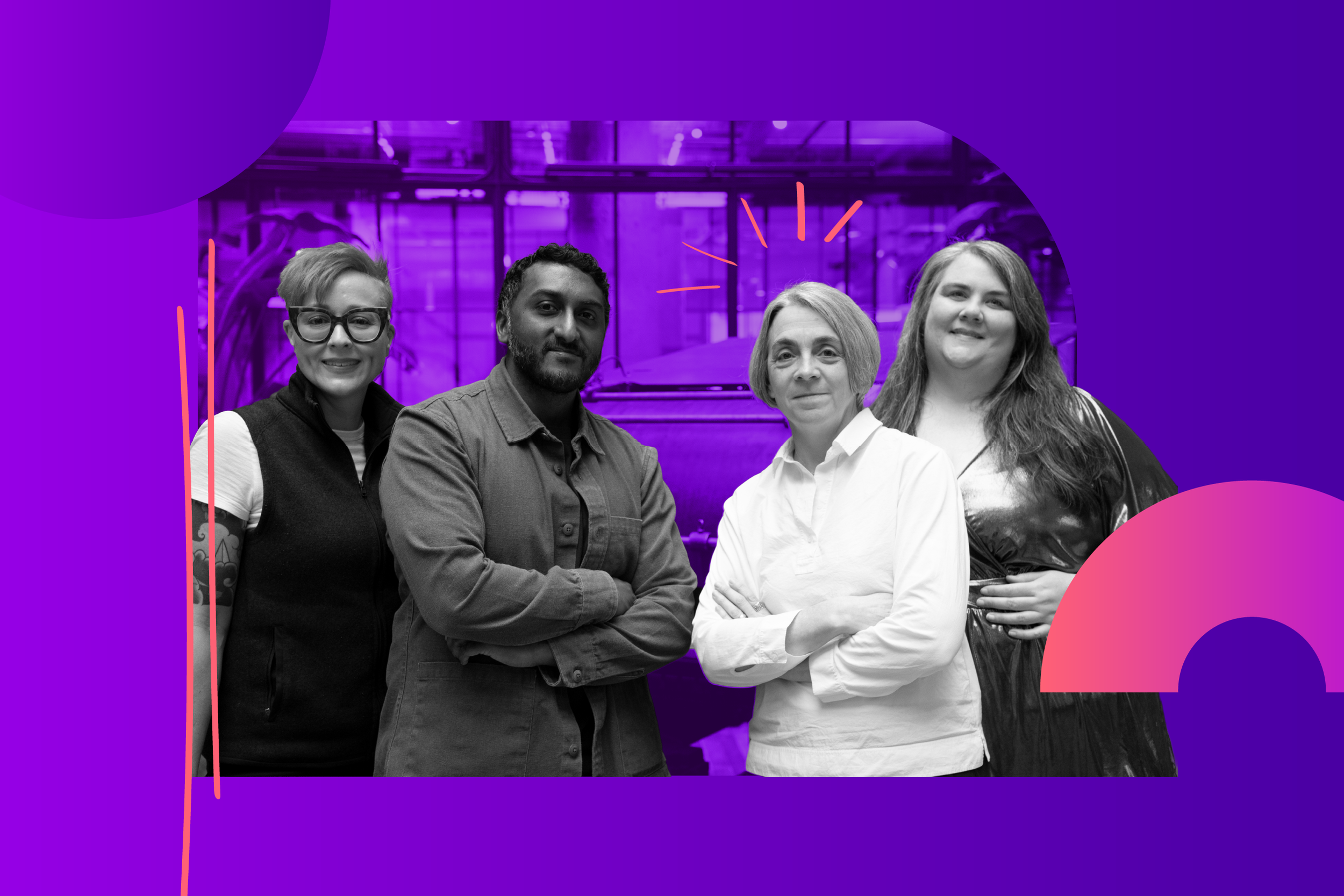 A group of four people standing together in an indoor setting with a purple background and modern decor.