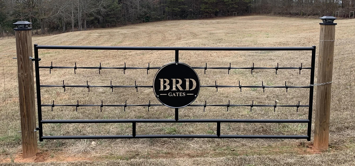 Close view of a completed Barbed Wire Gate with a personalized center insert