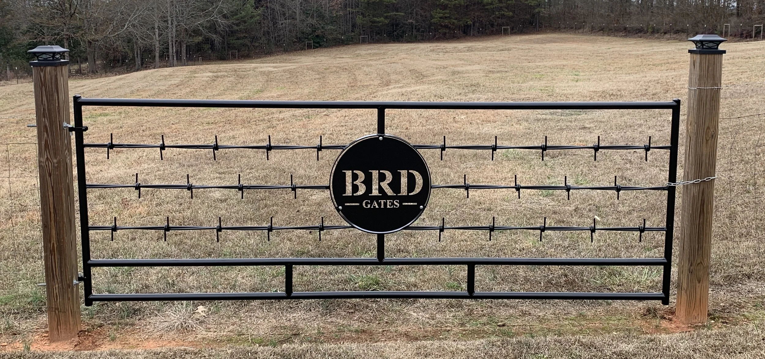 Completed Barbed Wire Gate with a personalized decorative center insert