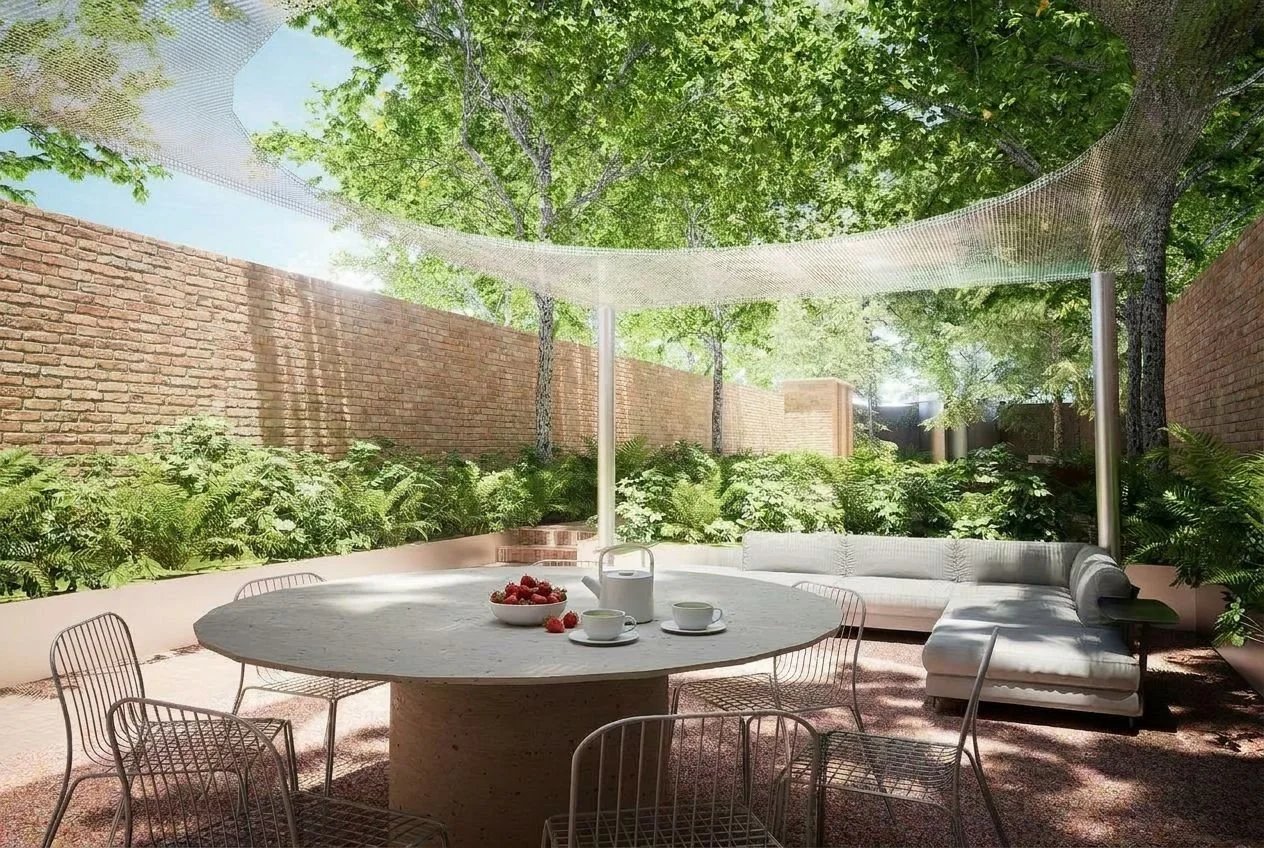 Nourishment Area - An outdoor gathering space that supports shared meals, conversation, a nourishment table, and connection with family and friends within a nature-rich setting.