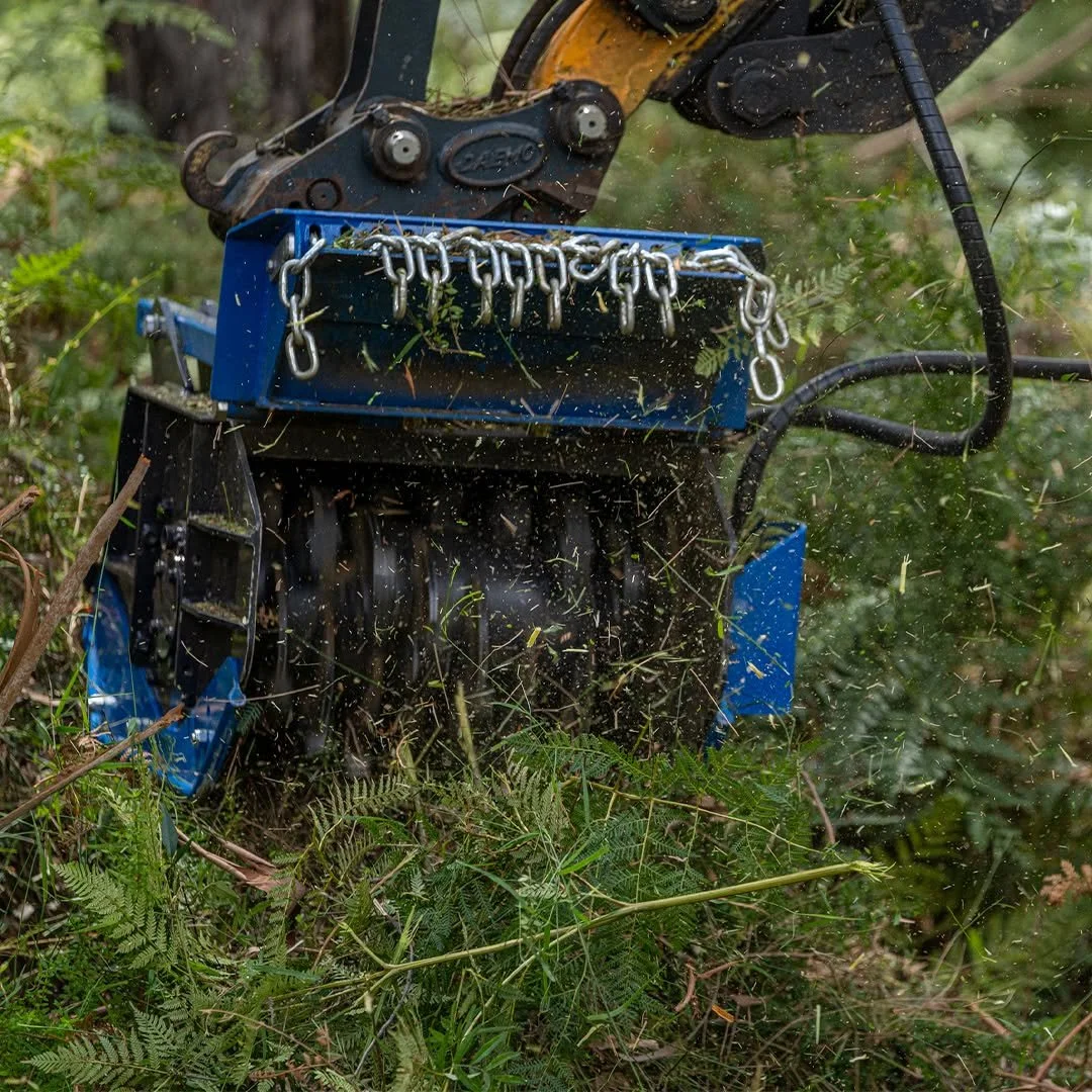 TFK forestry mulcher mounted on an excavator clearing dense vegetation and scrub in Australian conditions.