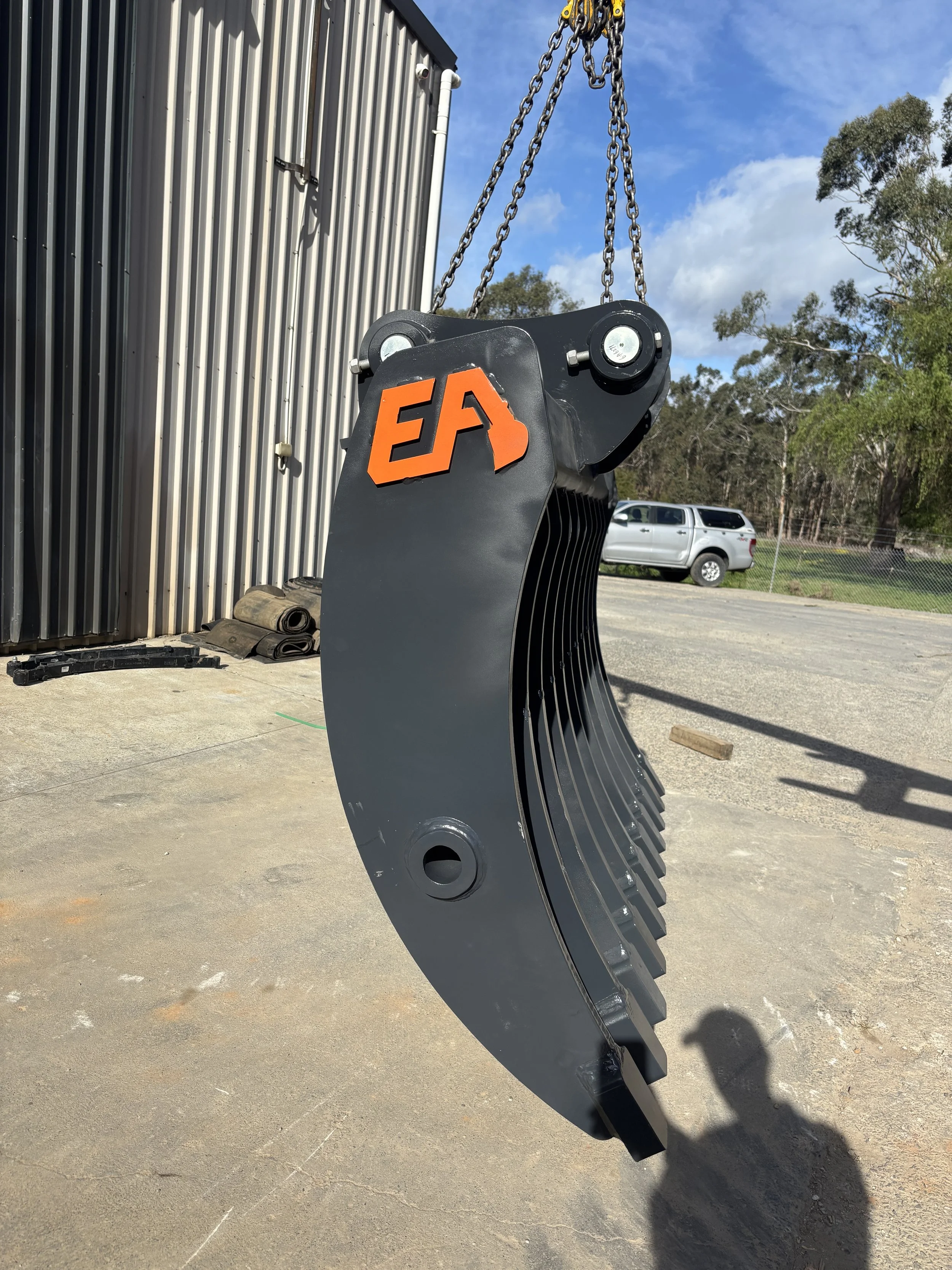 Excavator stick rake side view