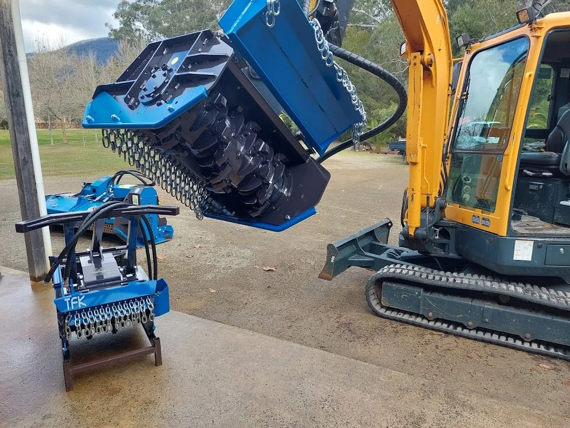 TFK forestry mulcher mounted on a mini excavator for vegetation management, land clearing and property maintenance