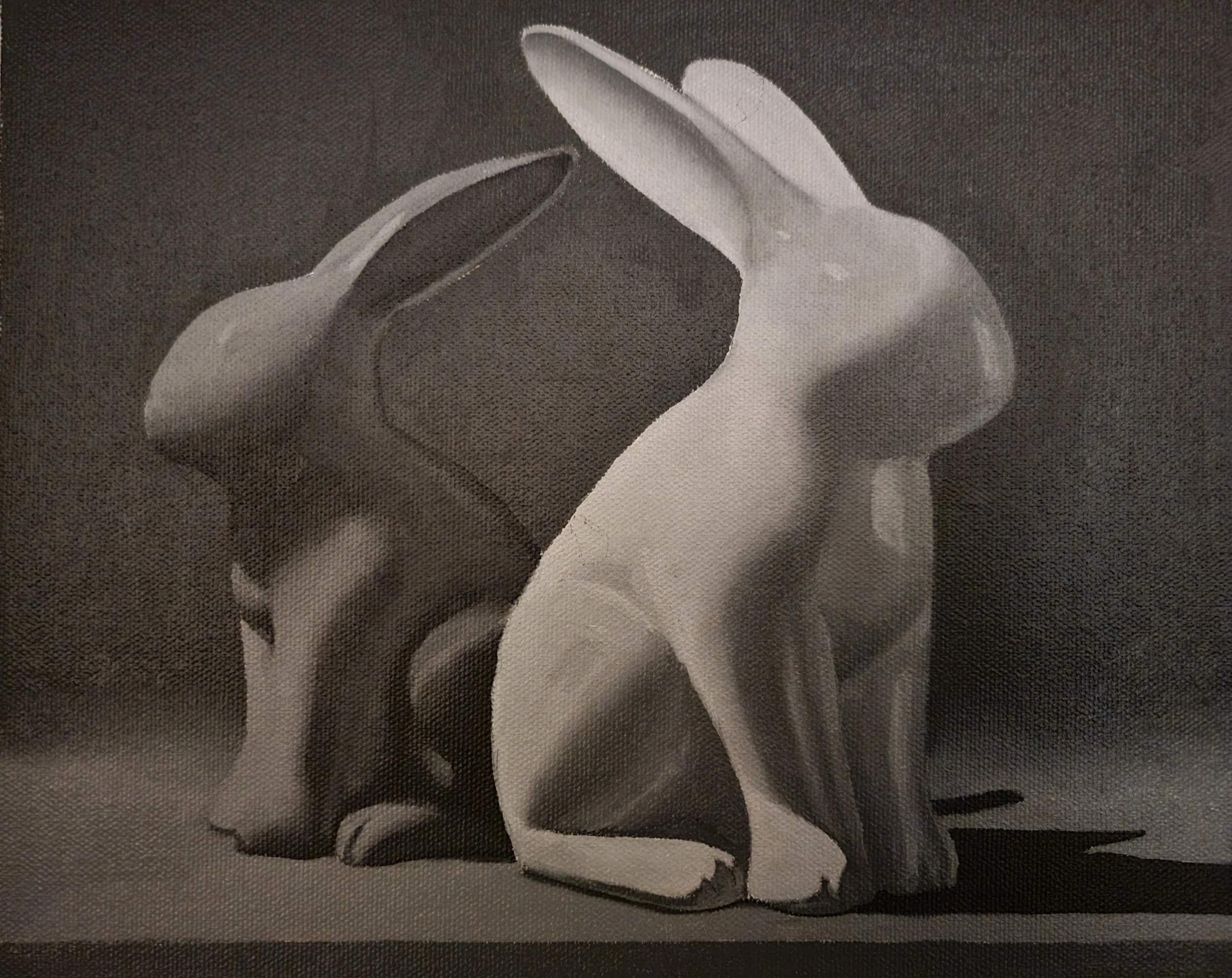 Gray scale oil painting of rabbits from painting assignment through Evolve Artist course.
