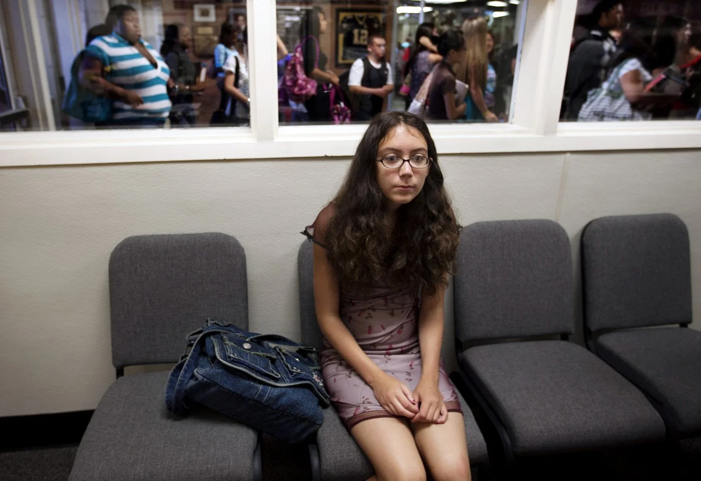 As Susquehanna Township high school students arrive for school, Jennifer Allen waits for her mother to bring her a change of clothes in Harrisburg, Pa. Allen’s clothing violated the new school dress code.