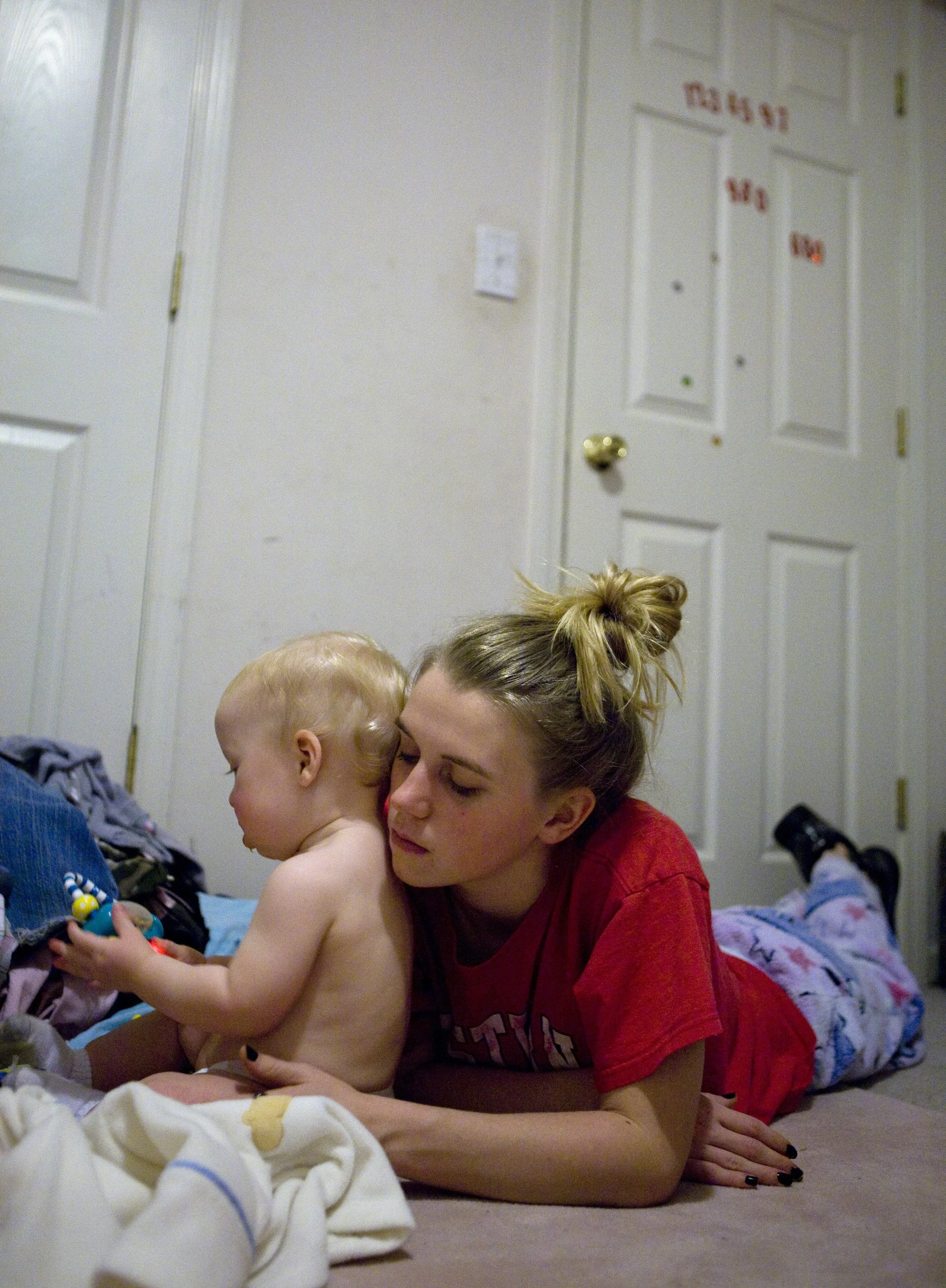 Brittney Gilleland, 17, sits with her 11-month-old Bryan Lee Bishop after she took him back from her mother in Franklin, Ky. Gilleland’s mother hadn’t let Brittney visit her son for four days. ”He won’t be with me for long. She is always trying to ke