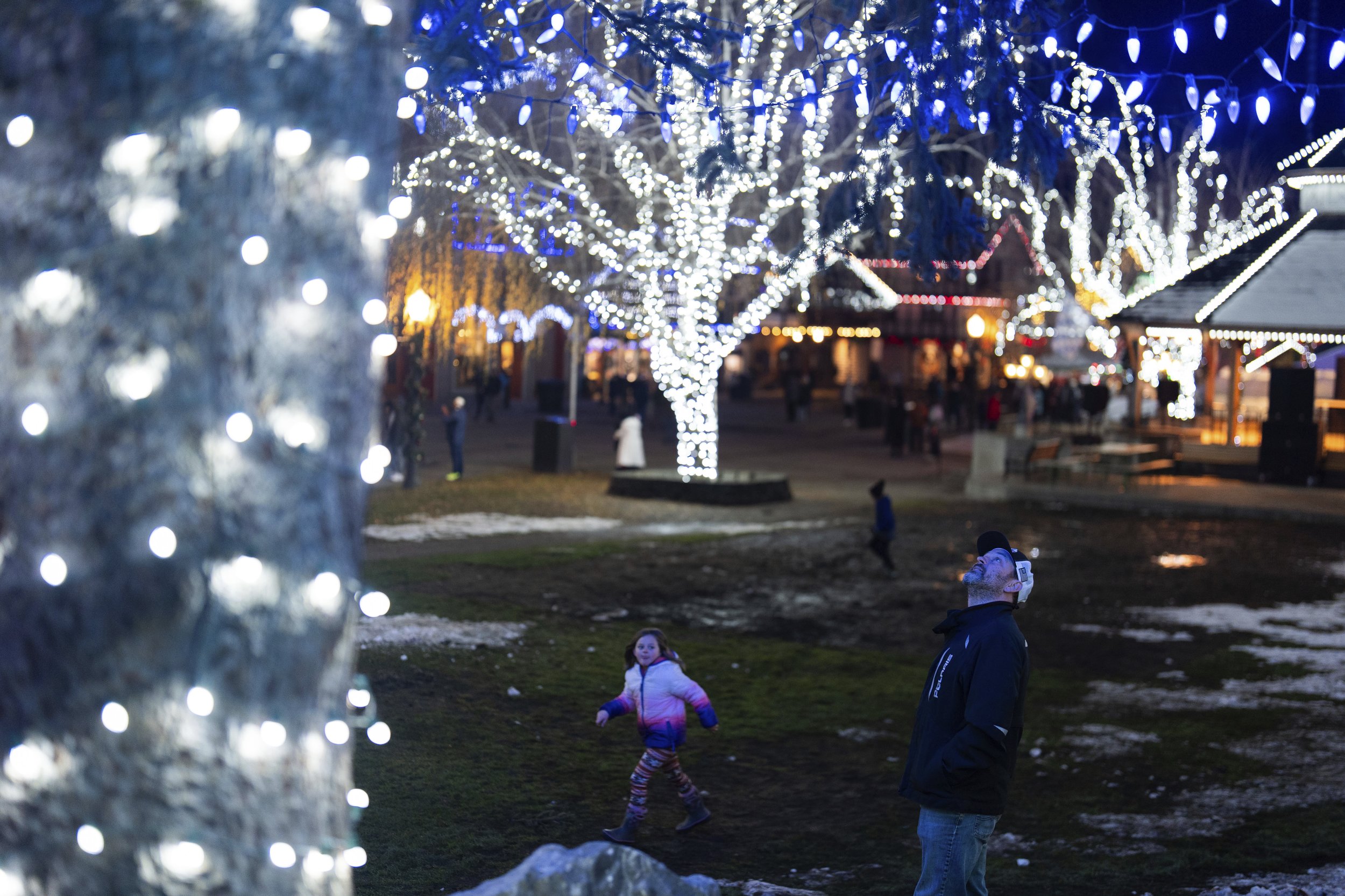 A person looks up at lights at Front Street Park on Wednesday, Nov. 27, 2024, in Leavenworth, Wash.