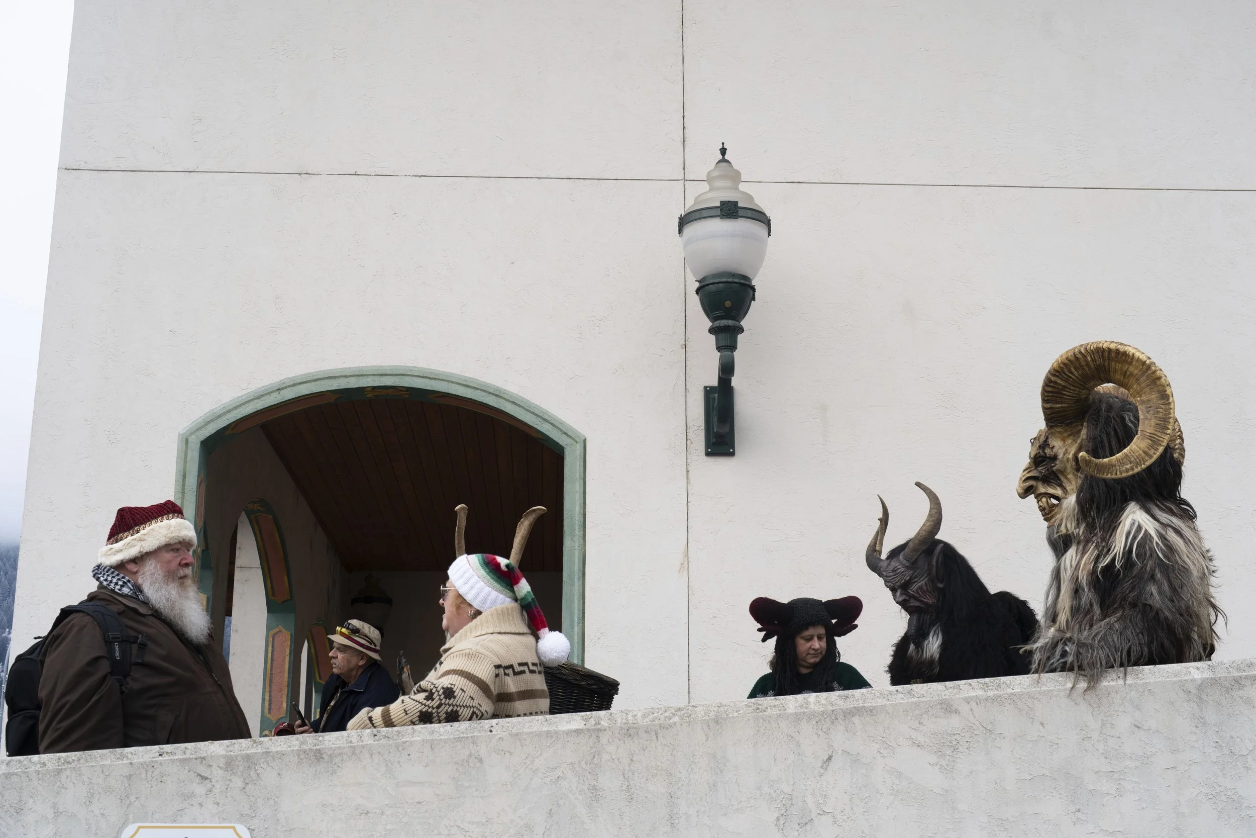 Members of the Krampus Seattle and Krampus Bremerton groups gather before walking down Front Street as part of a Krampuslauf Leavenworth event on Saturday, Nov. 30, 2024, in Leavenworth, Wash.
