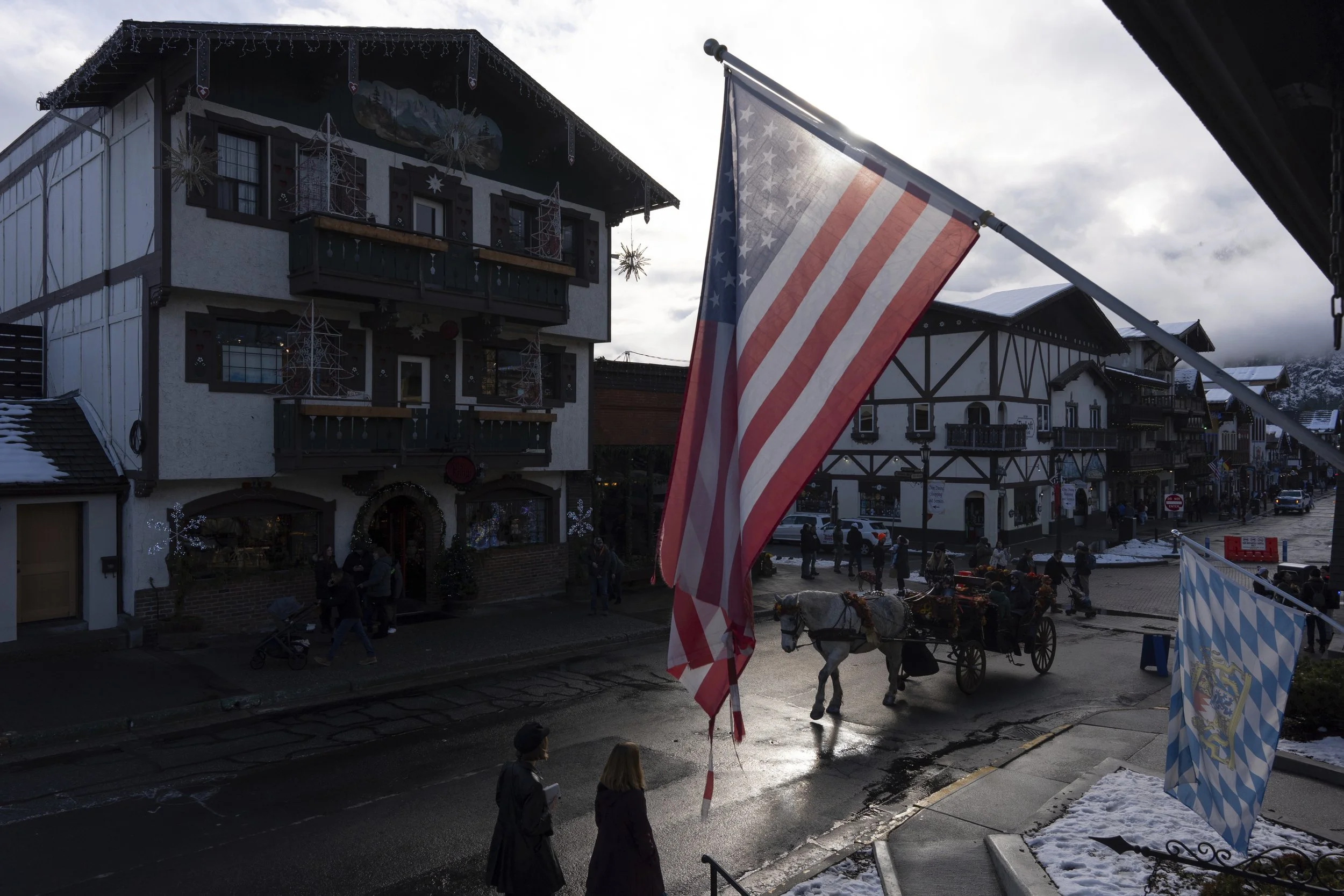 Coachman Teresa Eddings leads Daisy, a Belgian draft horse, as she pulls a carriage down Front Street, Monday, Nov. 25, 2024, in Leavenworth, Wash. 