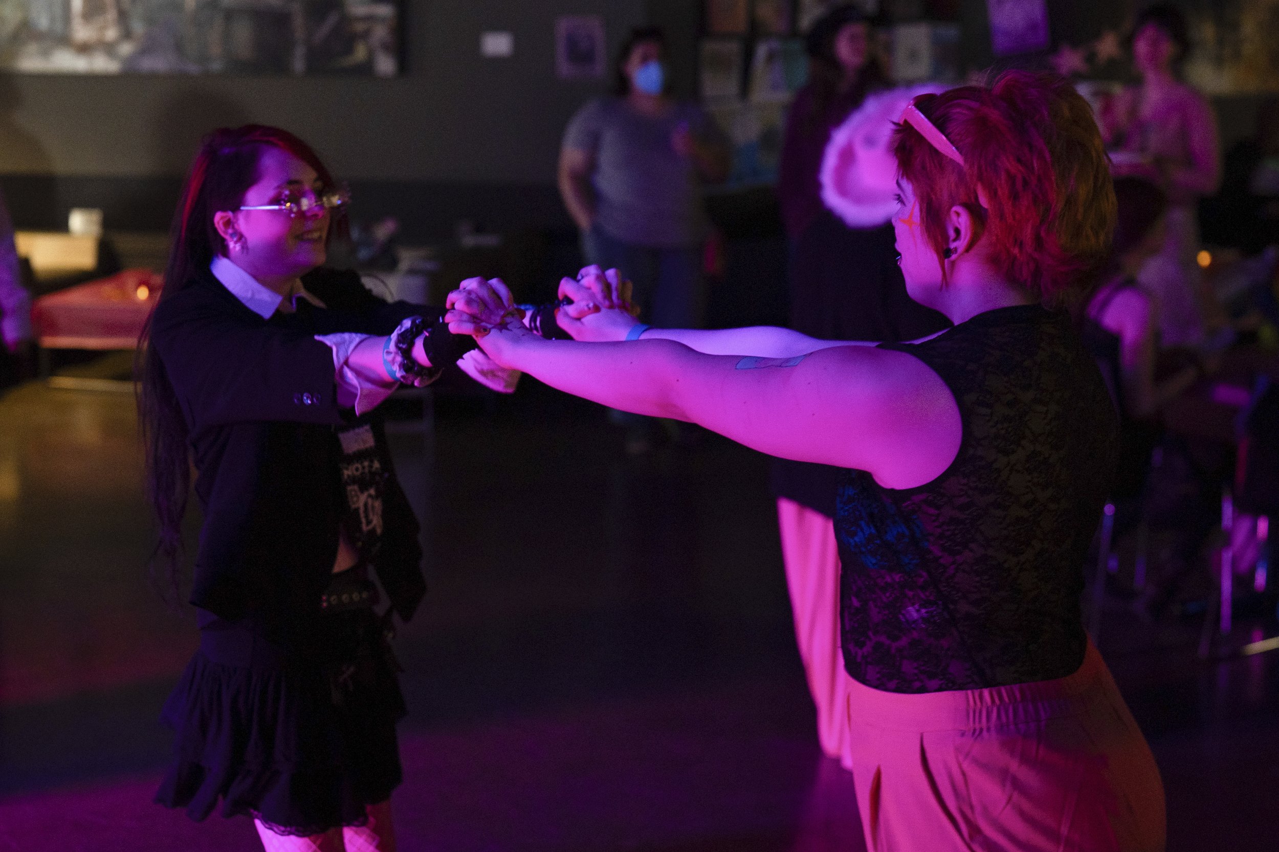 Caspian Brooks and June Arney, left, dance together during a “Pink Pony Prom” on Friday, May 30, 2025, in Portland, Ore.