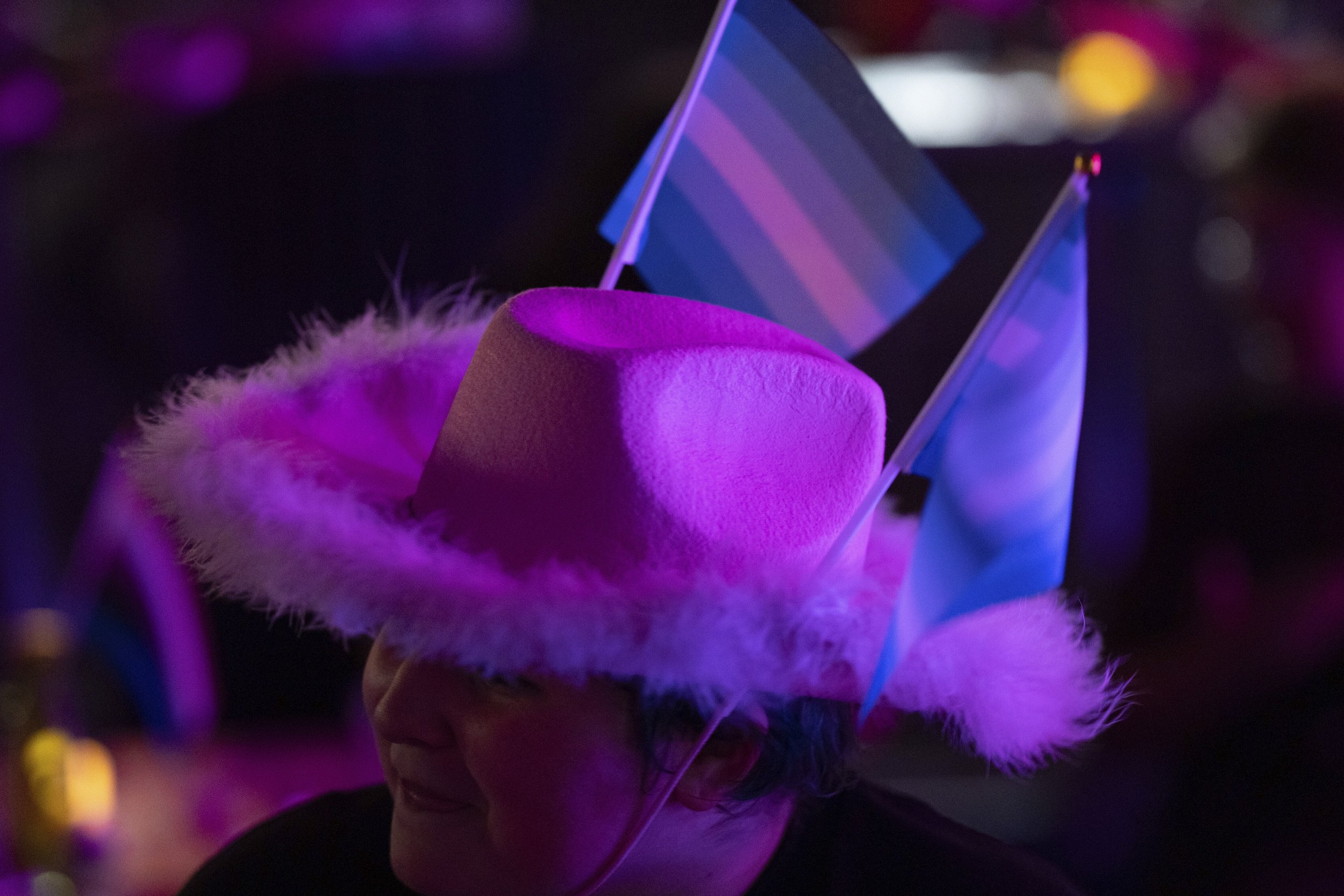 An attendee wears gay pride flags in their hat during a "Pink Pony Prom" held to celebrate teen and young adult members of the LGBTQ+ community on Friday, May 30, 2025, in Portland, Ore. 