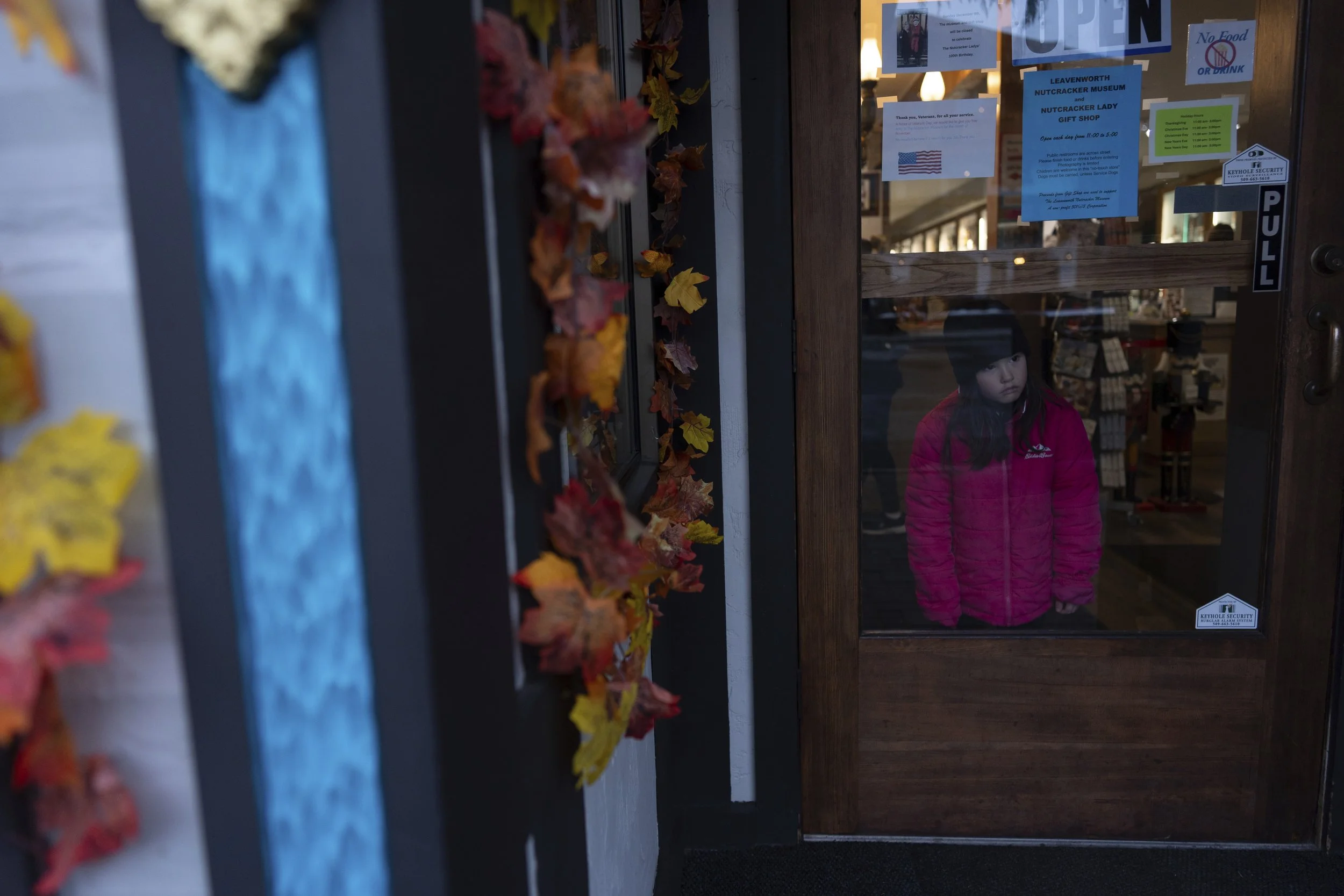 Erica Irwin, 6, looks out the door as she waits for her sister at the Leavenworth Nutcracker Museum, Wednesday, Nov. 27, 2024, in Leavenworth, Wash. 